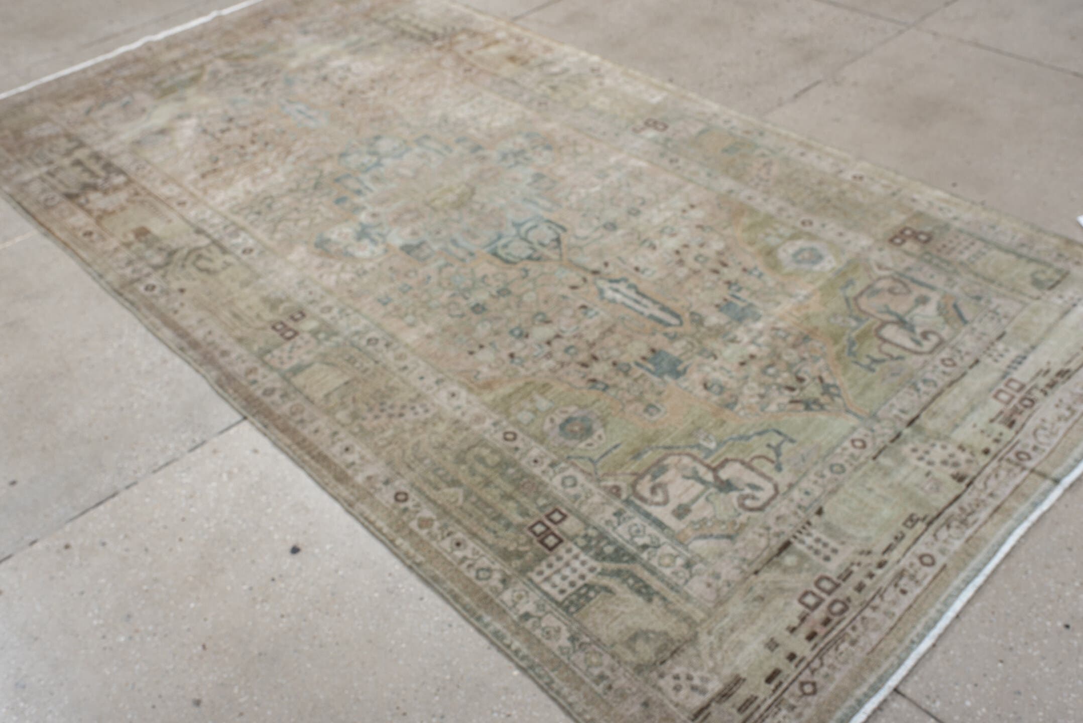 5' x 9' one-of-a-kind handmade antique Malayer medium size rug. Color palette: ivory, taupe, pale blue, beige, camel