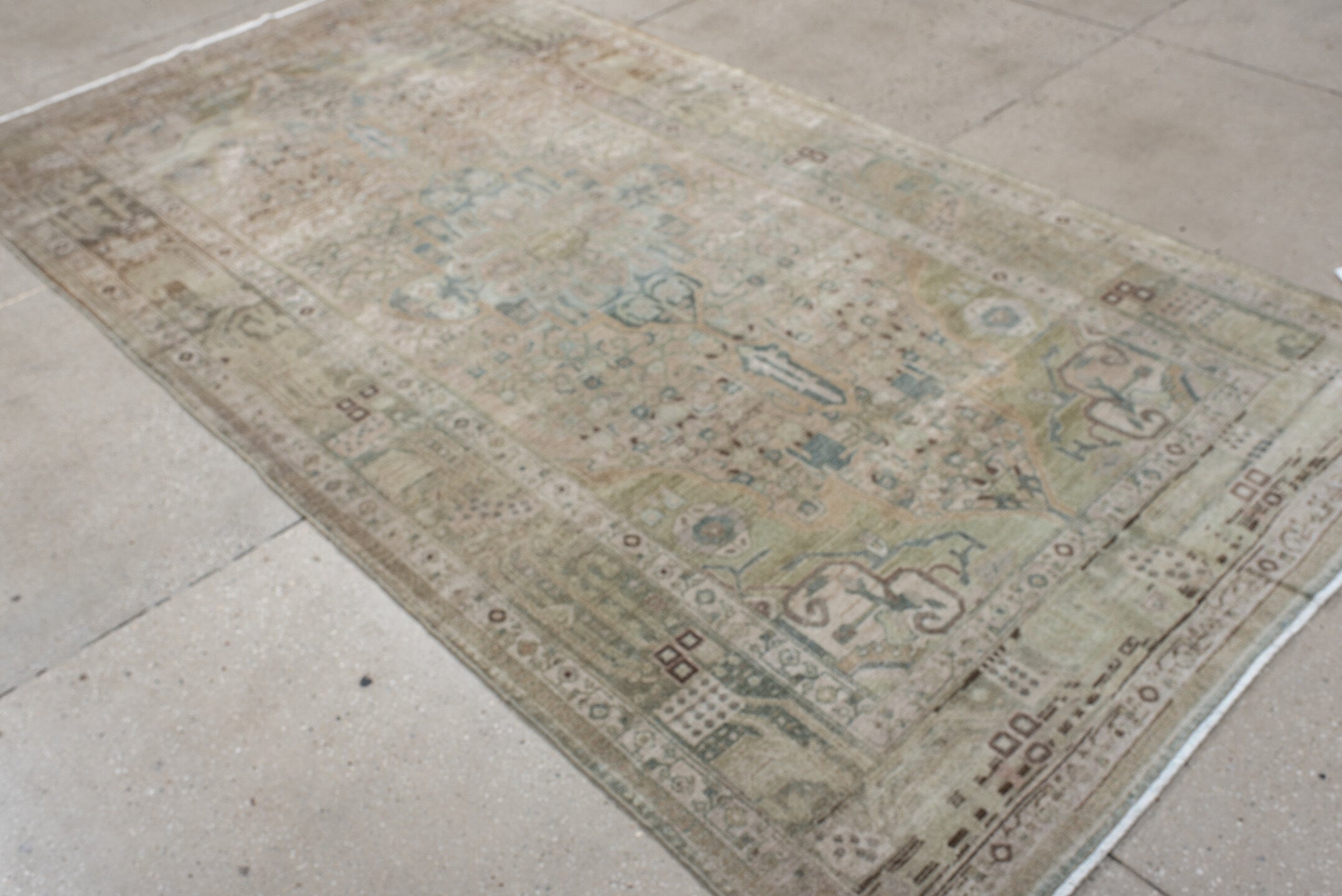 5' x 9' one-of-a-kind handmade antique Malayer medium size rug. Color palette: ivory, taupe, pale blue, beige, camel