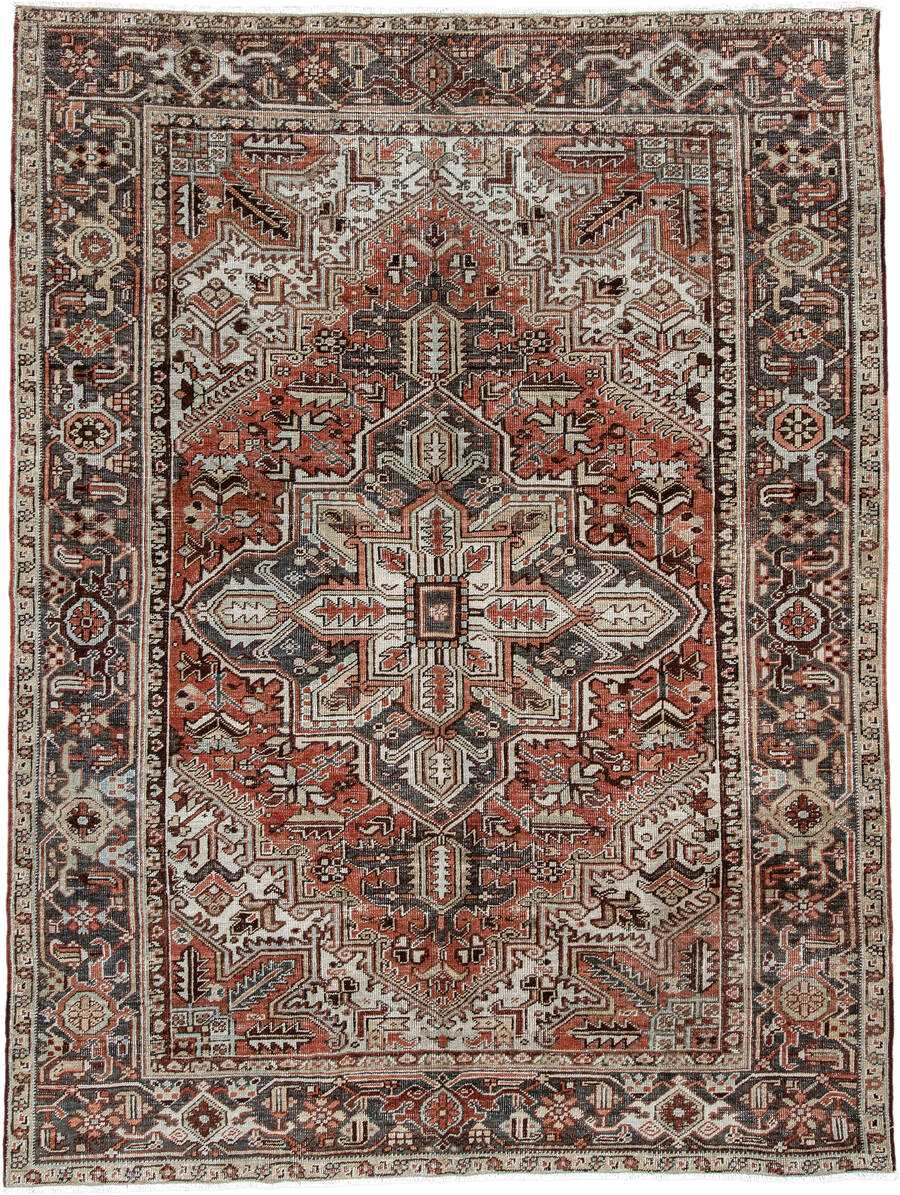 6' x 9' one-of-a-kind handmade antique Heriz medium size rug. Color palette: rust, ivory, navy, charcoal, camel, terra cotta