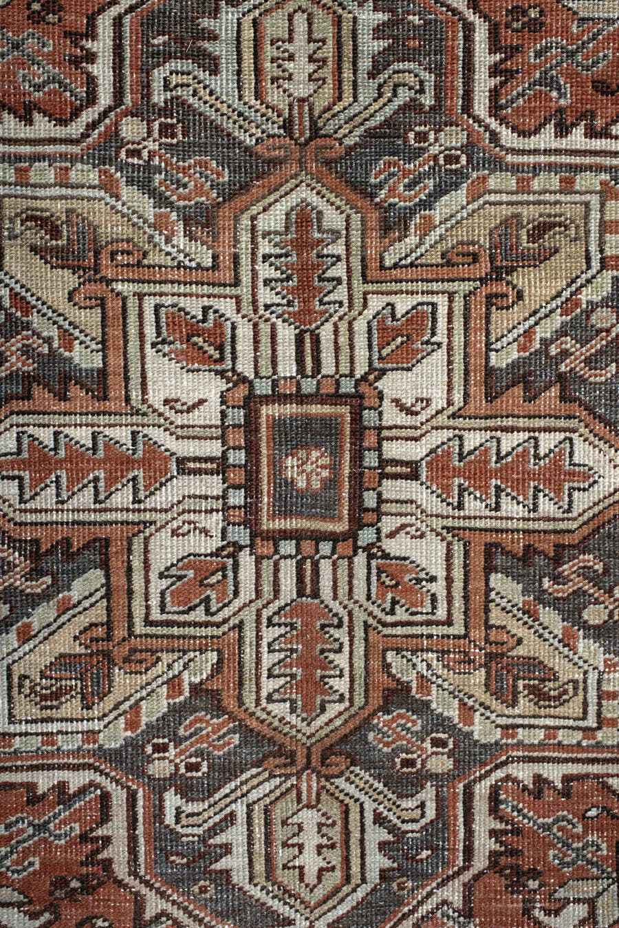 6' x 9' one-of-a-kind handmade antique Heriz medium size rug. Color palette: rust, ivory, navy, charcoal, camel, terra cotta