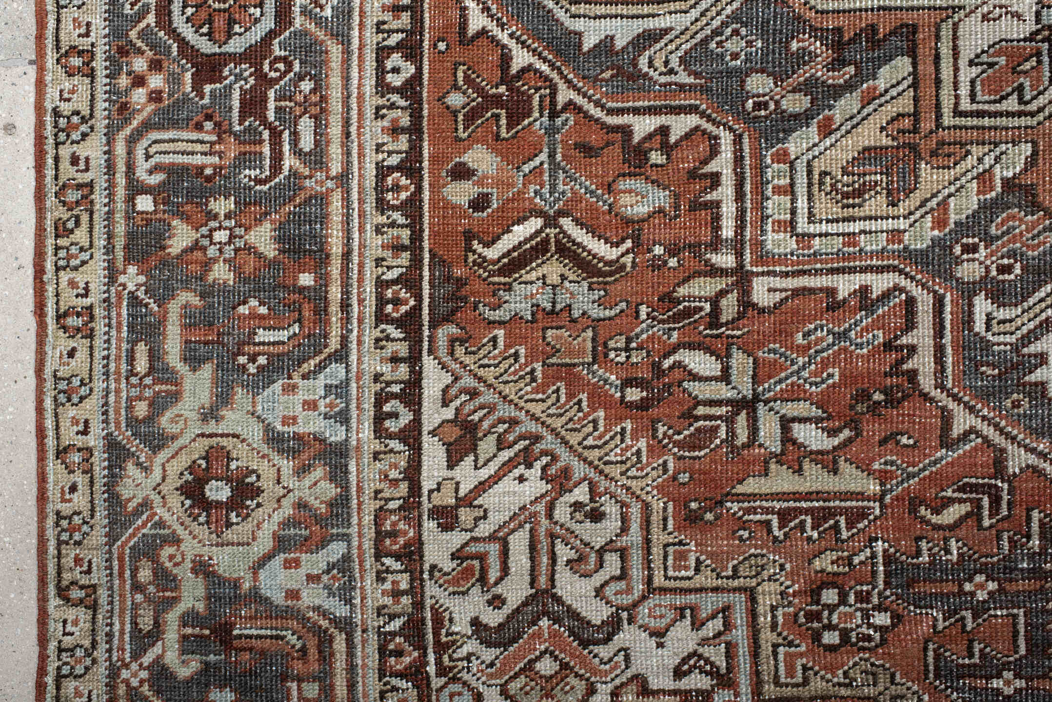 6' x 9' one-of-a-kind handmade antique Heriz medium size rug. Color palette: rust, ivory, navy, charcoal, camel, terra cotta