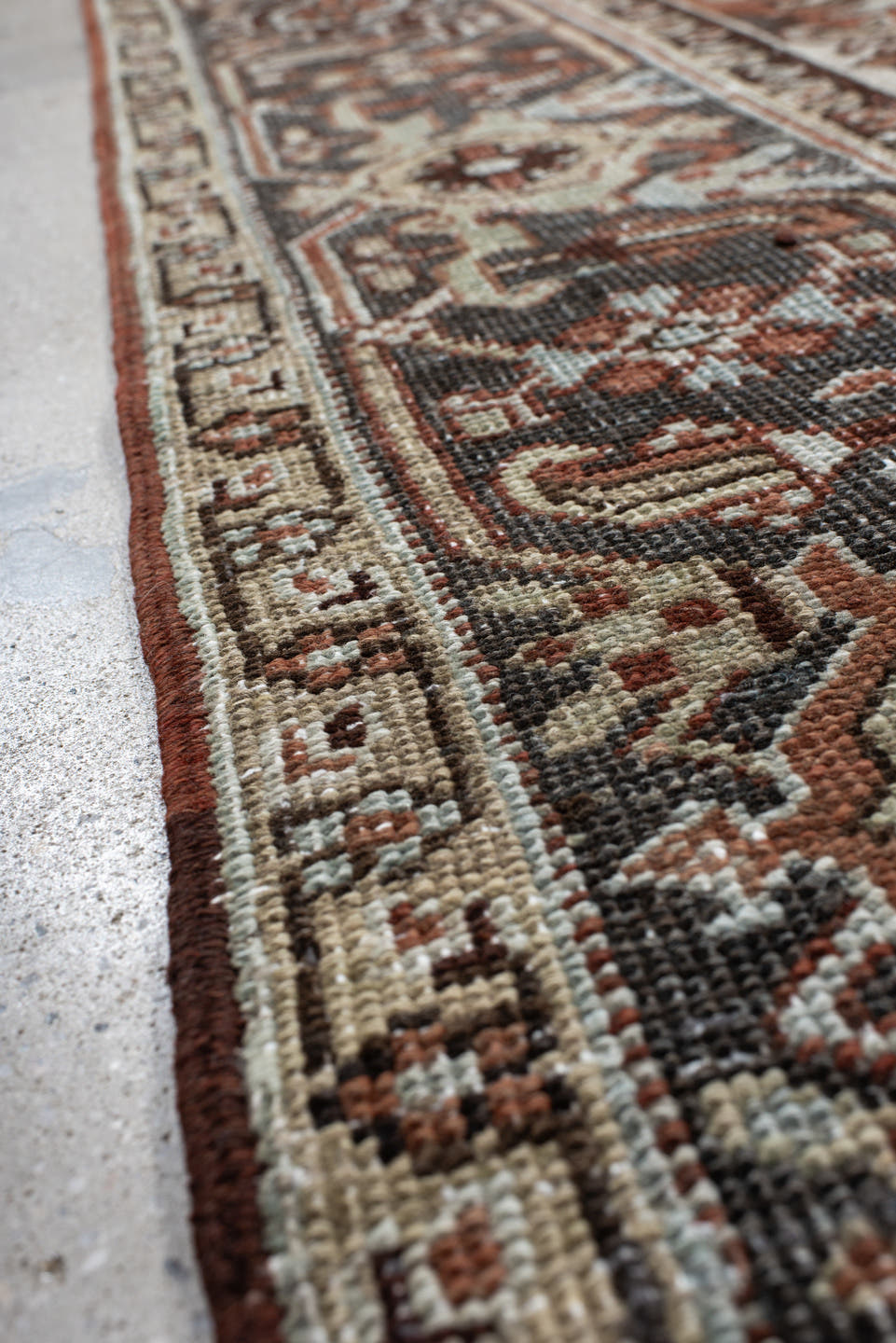 6' x 9' one-of-a-kind handmade antique Heriz medium size rug. Color palette: rust, ivory, navy, charcoal, camel, terra cotta