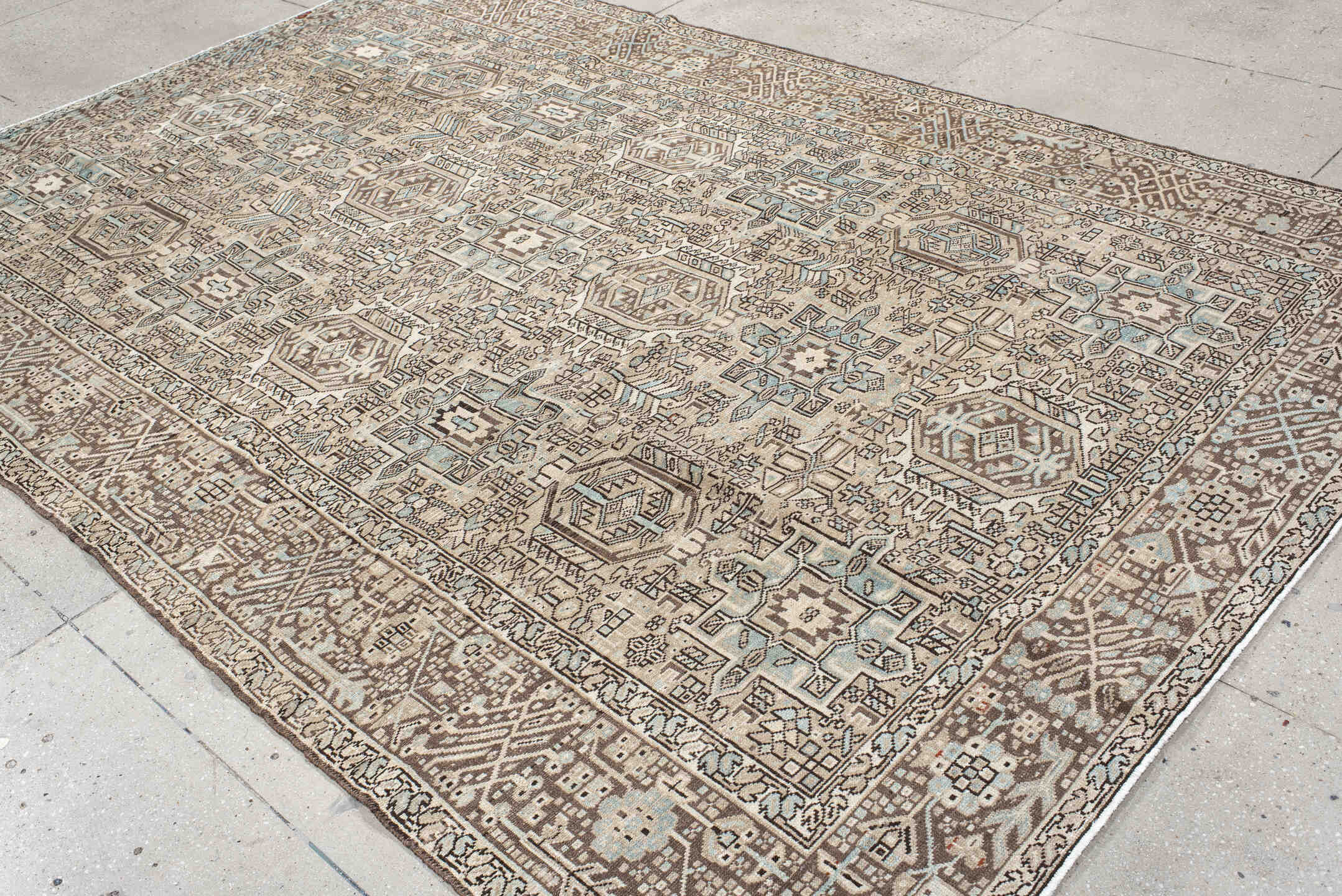 7' x 11' one-of-a-kind handmade antique Karaje large size rug. Color palette: ivory, brown, sky blue, taupe, camel
