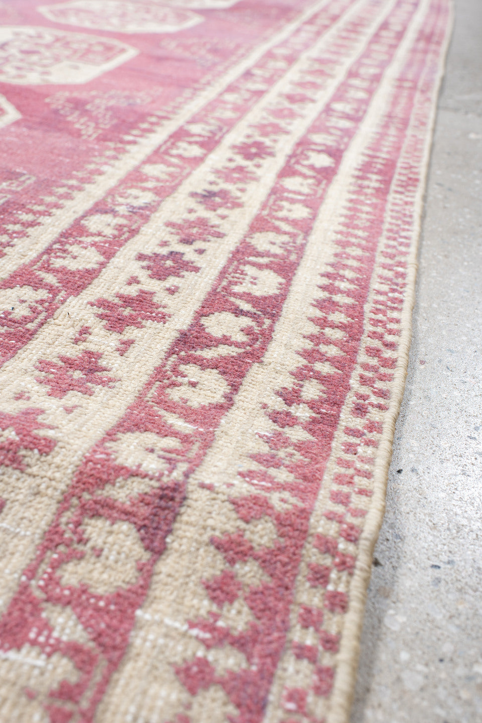 3' x 10' one-of-a-kind handmade vintage Afghan runner rug. Color palette: rose, ivory, dusty pink, burgundy, pink, red