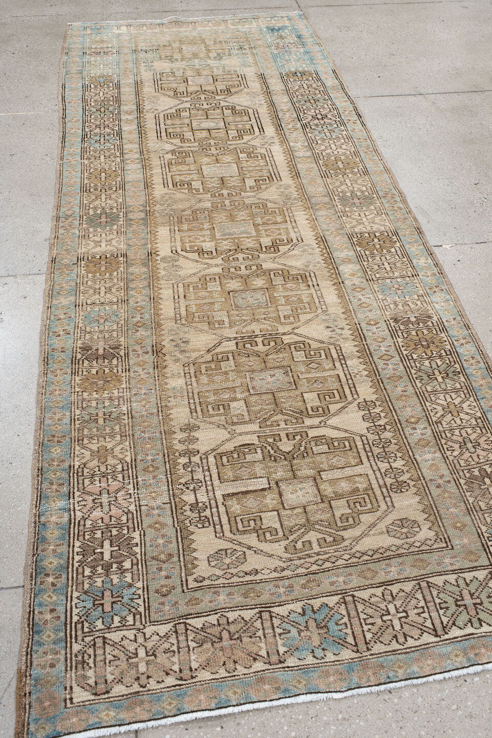 3' x 10' one-of-a-kind handmade antique Sarab runner rug. Color palette: ivory, sky blue, taupe, camel, brown, blush