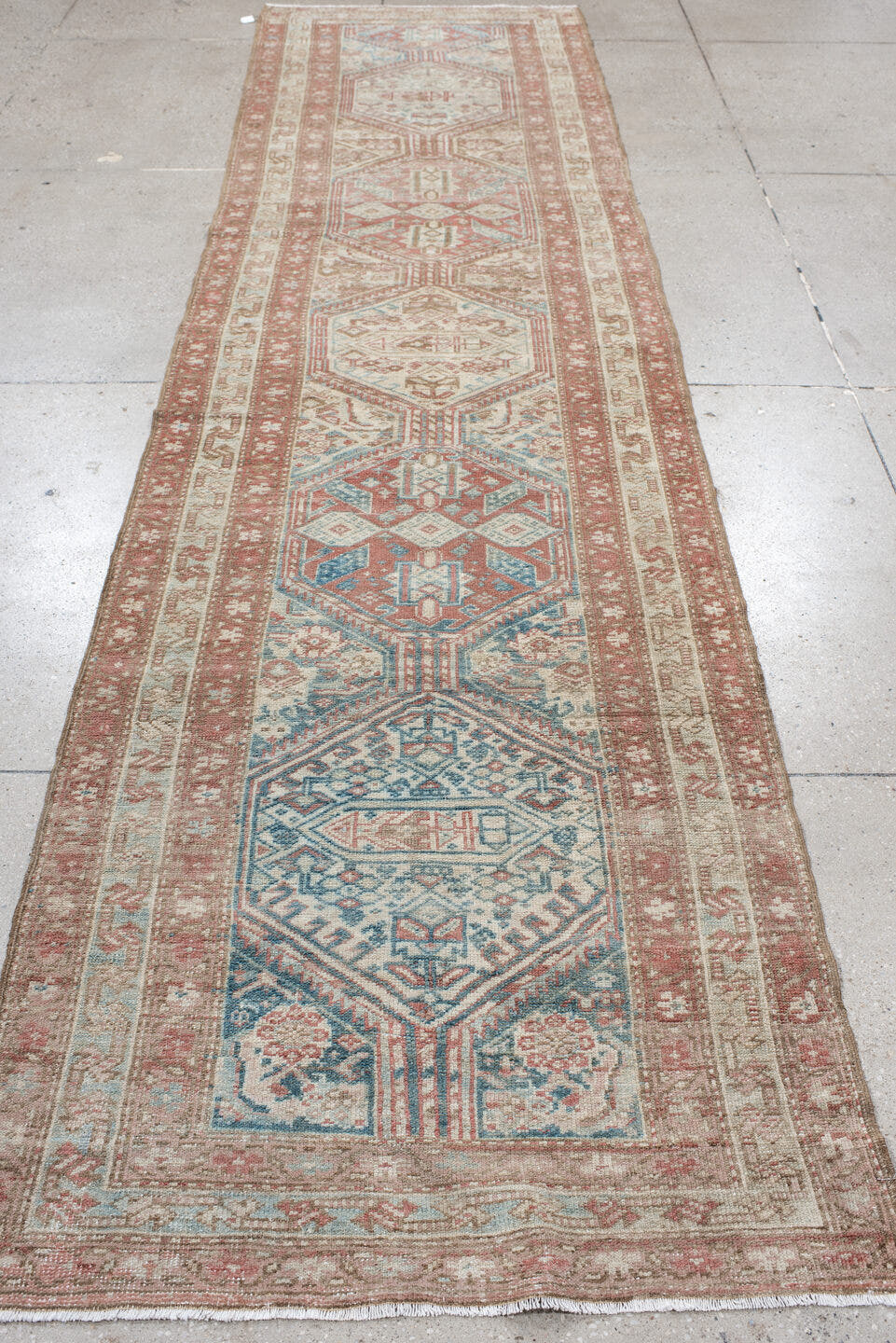 3' x 12' one-of-a-kind handmade vintage NW Persian runner rug. Color palette: ivory, rust, pale blue, taupe, camel
