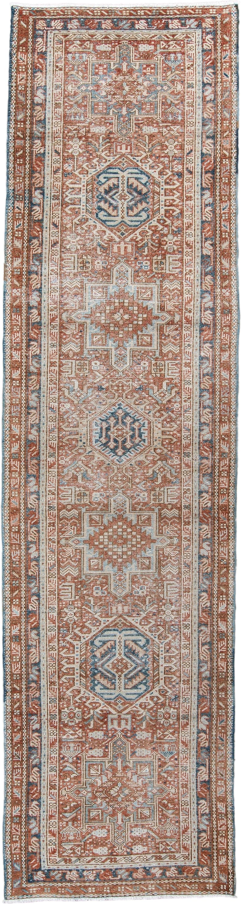 3' x 11' one-of-a-kind handmade antique Karaje runner rug. Color palette: terra cotta, ivory, sky blue, rust, camel, slate