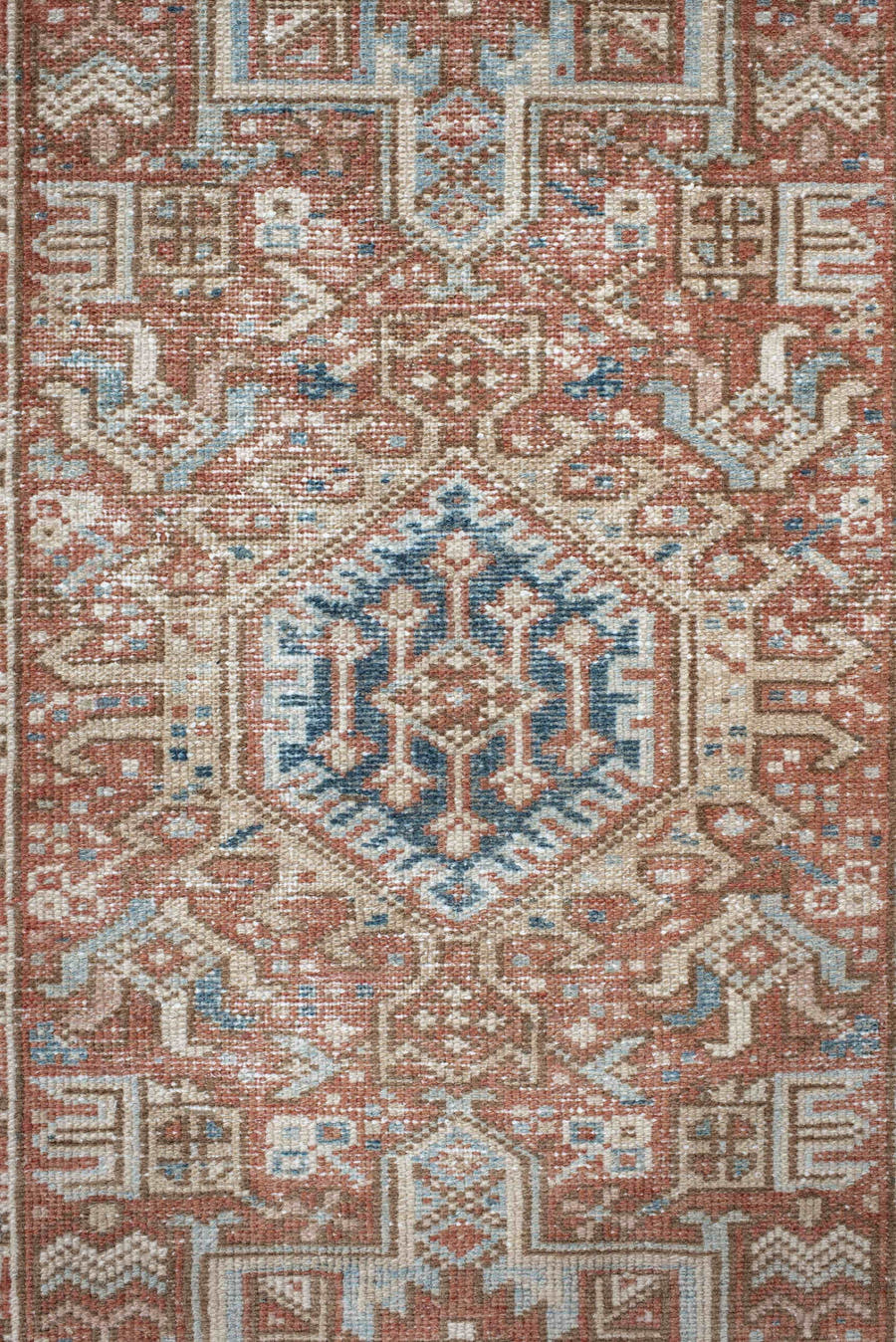 3' x 11' one-of-a-kind handmade antique Karaje runner rug. Color palette: terra cotta, ivory, sky blue, rust, camel, slate