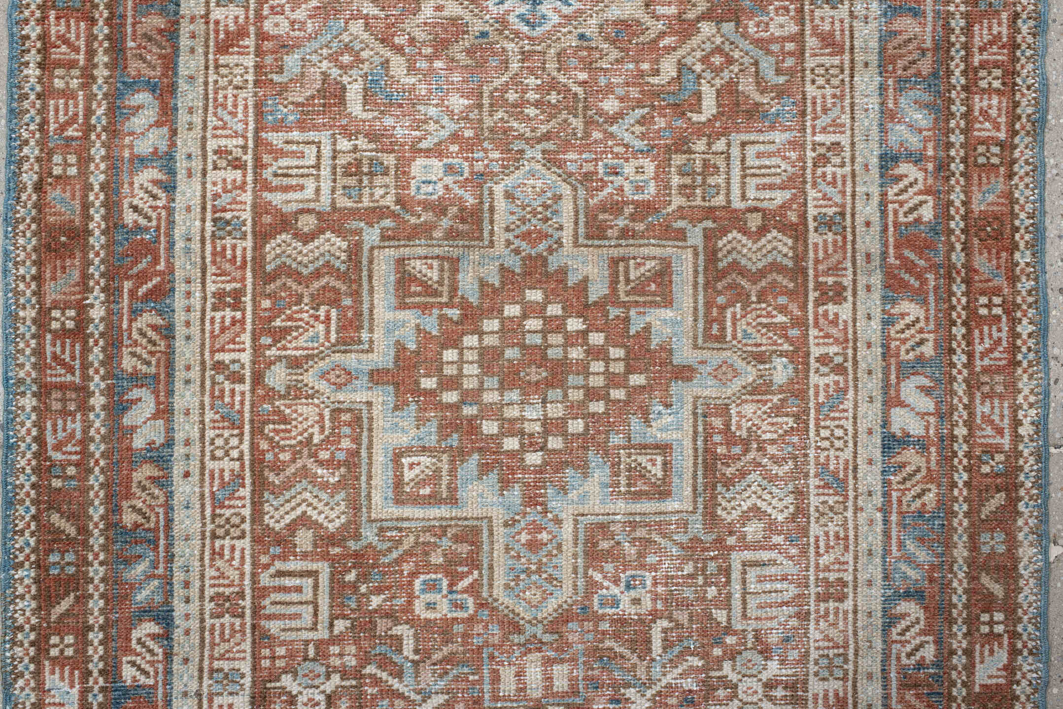 3' x 11' one-of-a-kind handmade antique Karaje runner rug. Color palette: terra cotta, ivory, sky blue, rust, camel, slate