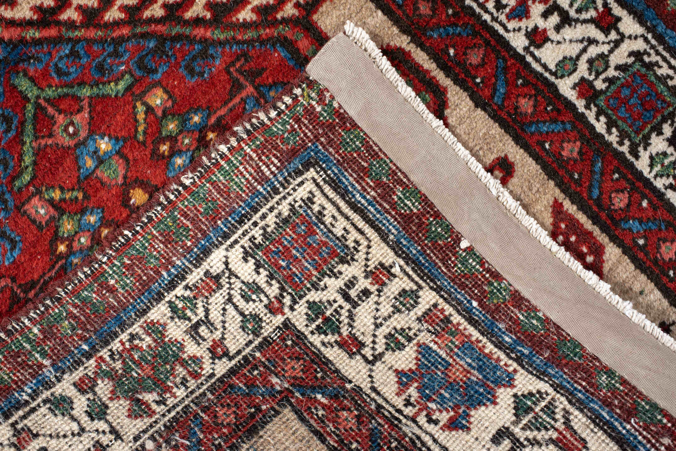 3' x 10' one-of-a-kind handmade antique Sarab runner rug. Color palette: ivory, rust, sky blue, crimson, navy, teal, brown