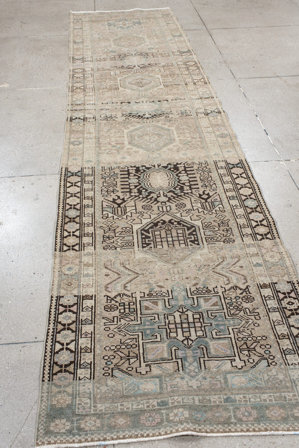 3' x 12' one-of-a-kind handmade antique Karaje runner rug. Color palette: ivory, taupe, pale blue, brown, charcoal, beige