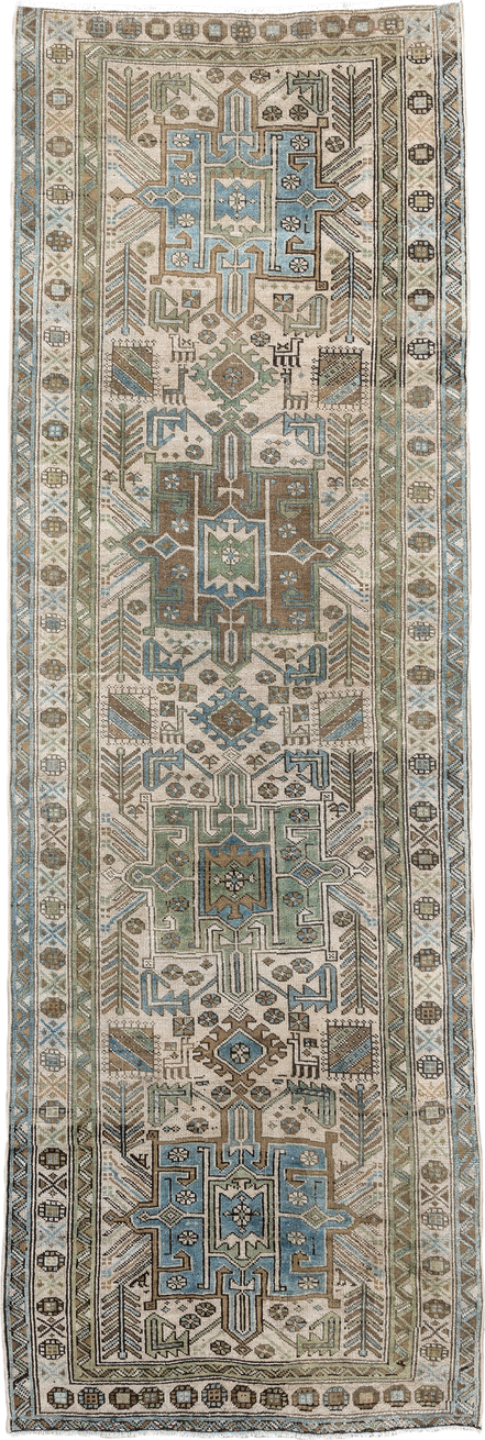 3' x 9' one-of-a-kind handmade vintage Heriz runner rug. Color palette: ivory, sky blue, taupe, brown, sage, charcoal
