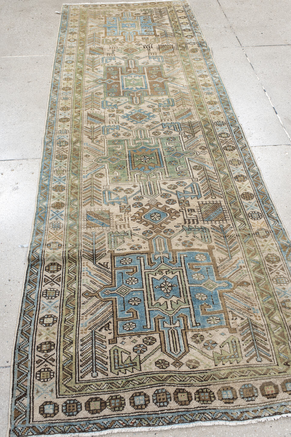 3' x 9' one-of-a-kind handmade vintage Heriz runner rug. Color palette: ivory, sky blue, taupe, brown, sage, charcoal
