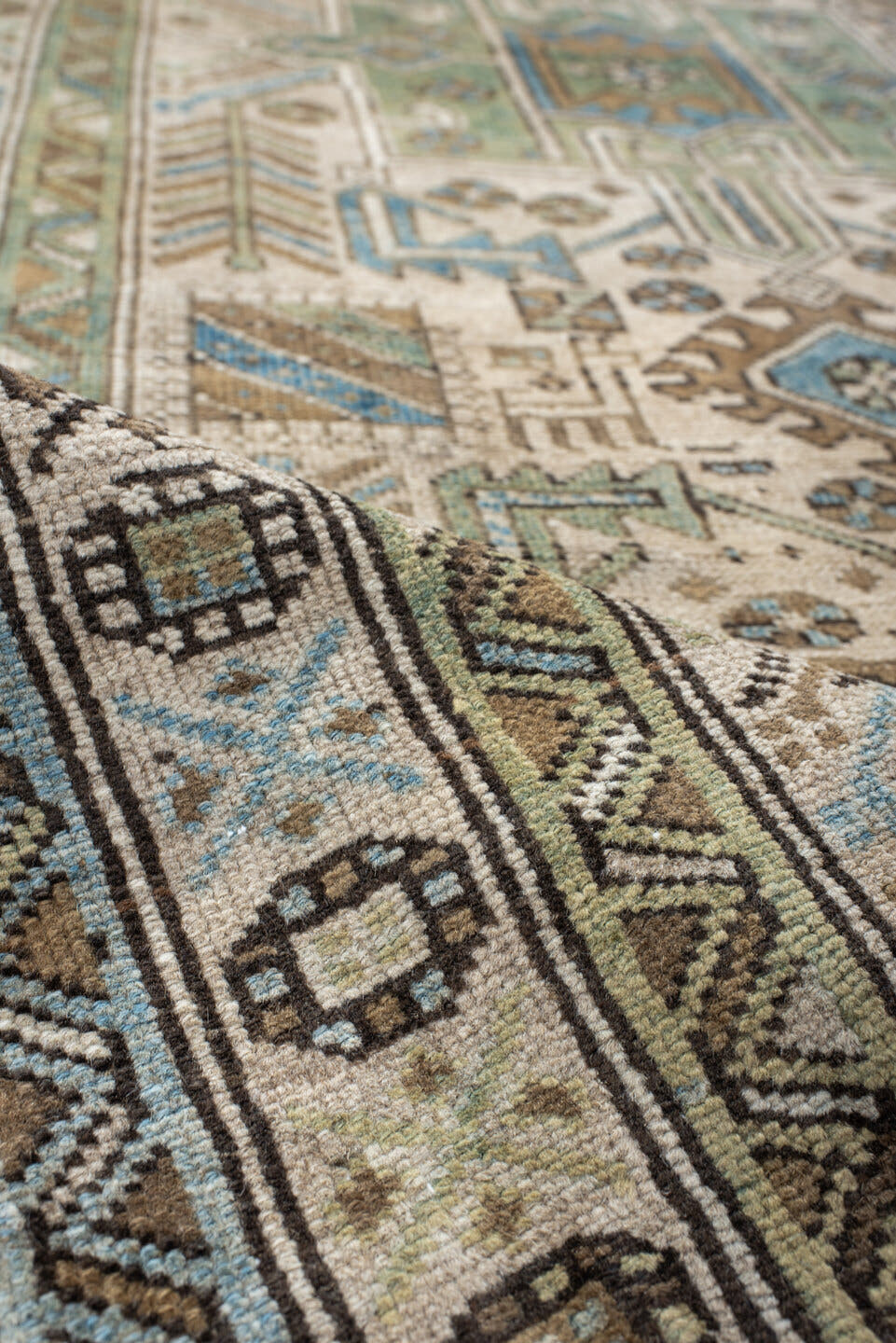 3' x 9' one-of-a-kind handmade vintage Heriz runner rug. Color palette: ivory, sky blue, taupe, brown, sage, charcoal