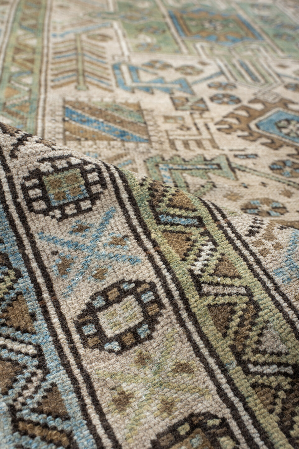3' x 9' one-of-a-kind handmade vintage Heriz runner rug. Color palette: ivory, sky blue, taupe, brown, sage, charcoal