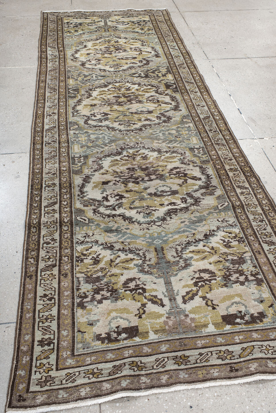 3' x 10' one-of-a-kind handmade vintage Baktiary runner rug. Color palette: ivory, brown, sage, taupe, gold, charcoal, green