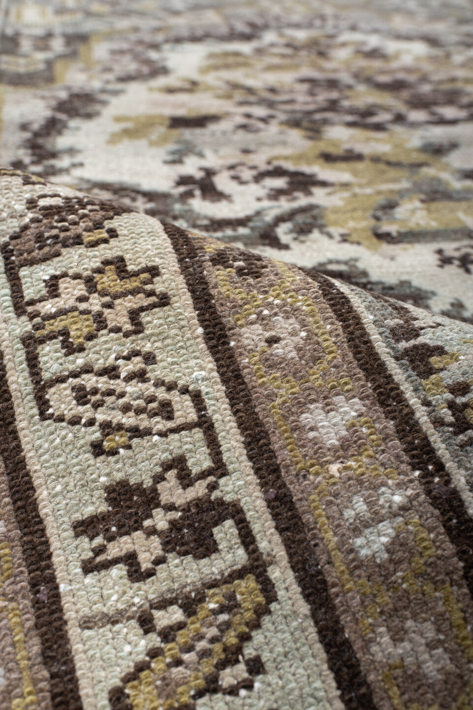 3' x 10' one-of-a-kind handmade vintage Baktiary runner rug. Color palette: ivory, brown, sage, taupe, gold, charcoal, green