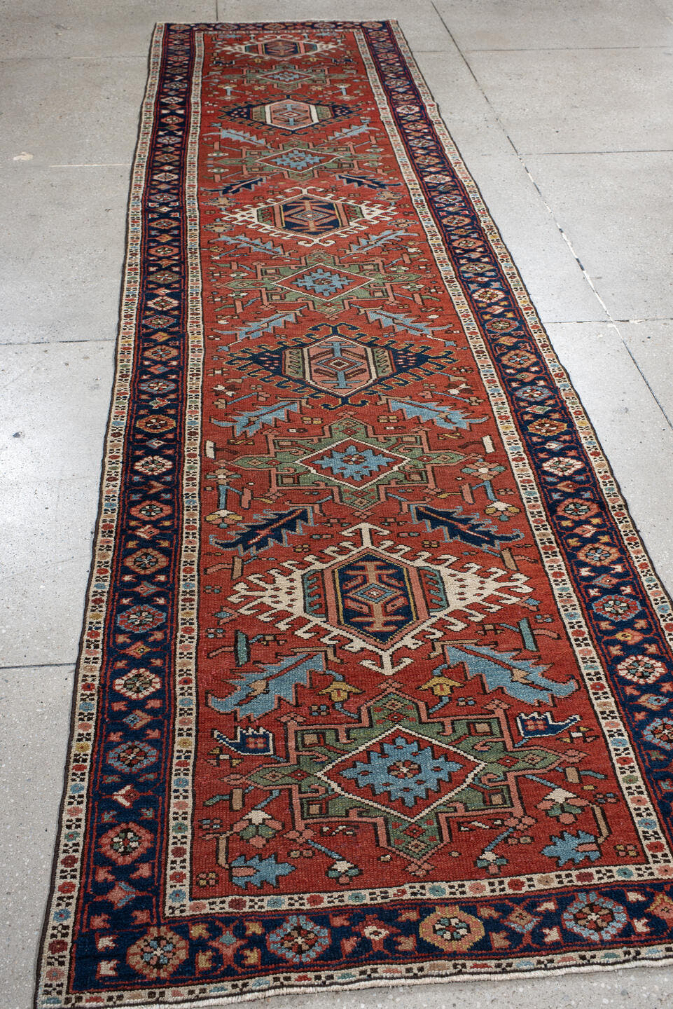 3' x 12' one-of-a-kind handmade antique Karaje runner rug. Color palette: rust, navy, ivory, sky_blue, sage, camel