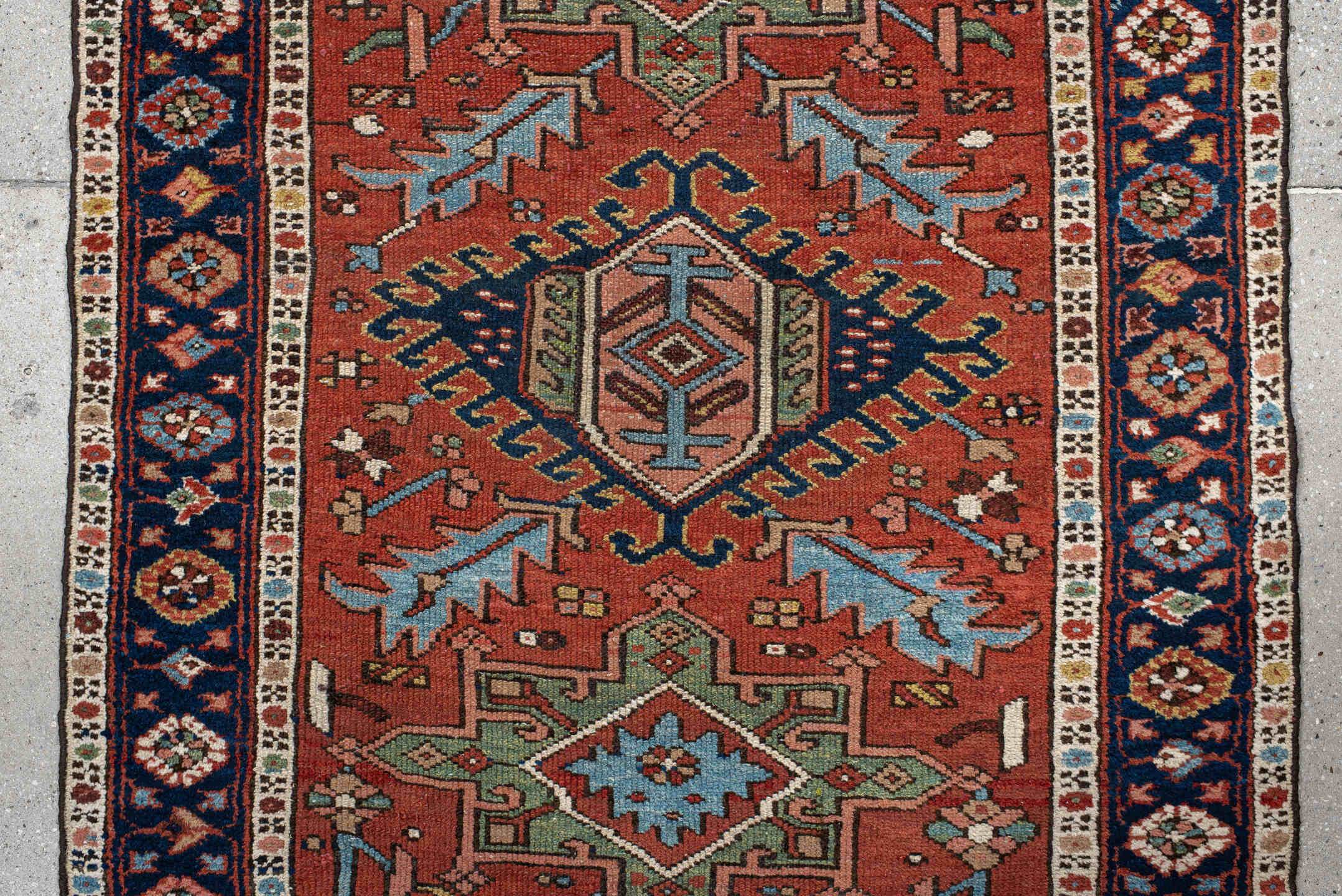 3' x 12' one-of-a-kind handmade antique Karaje runner rug. Color palette: rust, navy, ivory, sky_blue, sage, camel