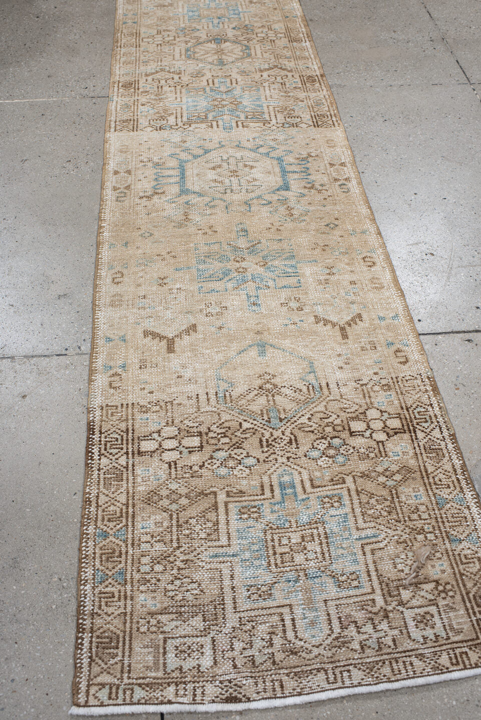 2' x 7' one-of-a-kind handmade antique Karaje runner rug. Color palette: ivory, camel, sky_blue, taupe, beige, light_brown