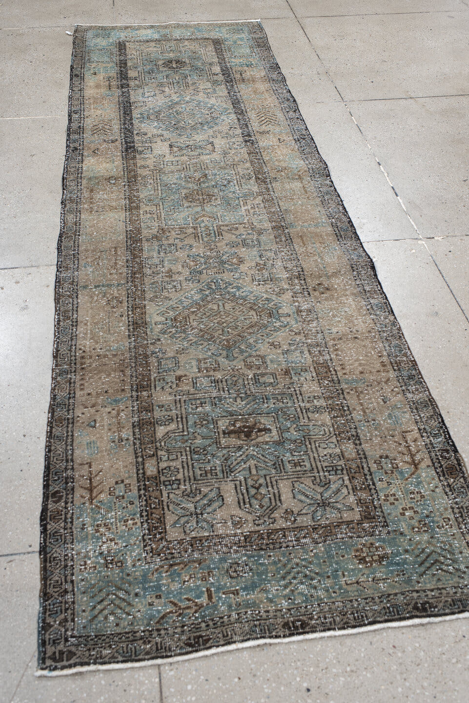3' x 10' one-of-a-kind handmade antique Karaje runner rug. Color palette: taupe, sky blue, ivory, charcoal, slate, brown