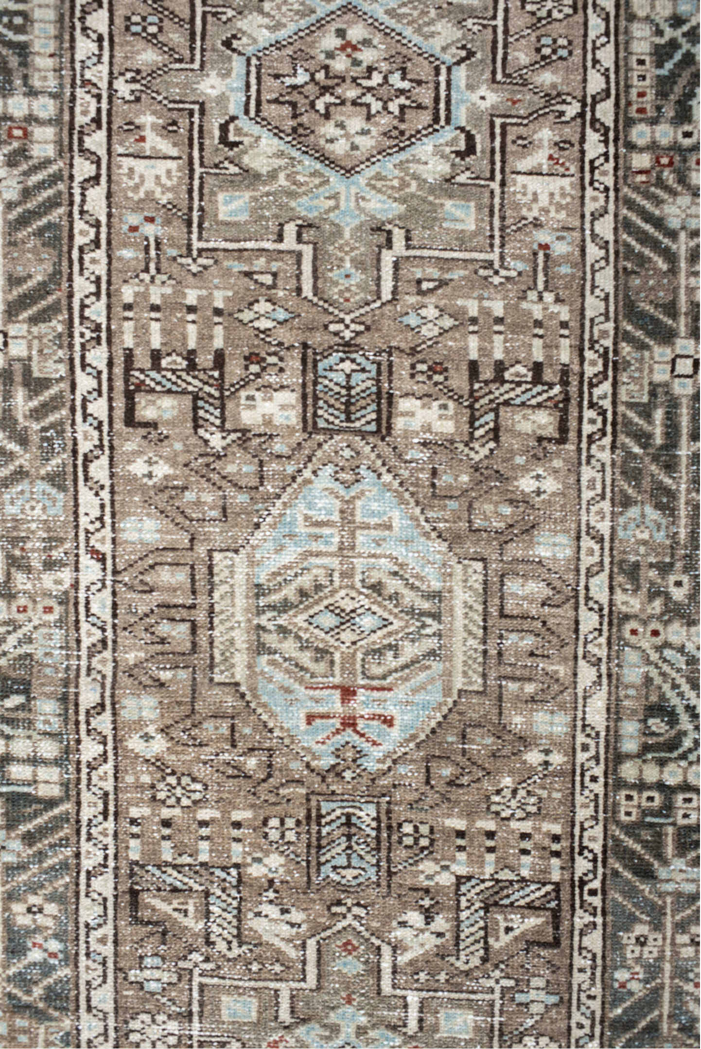 2' x 10' one-of-a-kind handmade vintage Karaje runner rug. Color palette: taupe, charcoal, ivory, pale blue, rust, brown