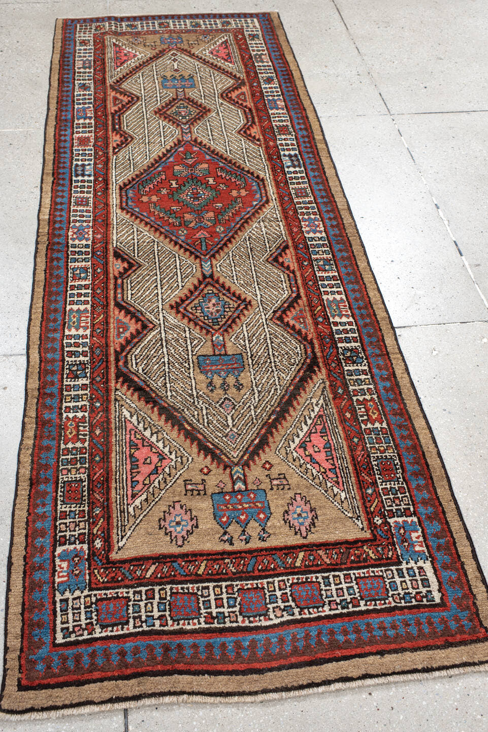 2' x 8' one-of-a-kind handmade antique Sarab runner rug. Color palette: ivory, rust, indigo, camel, rose, charcoal, sky_blue