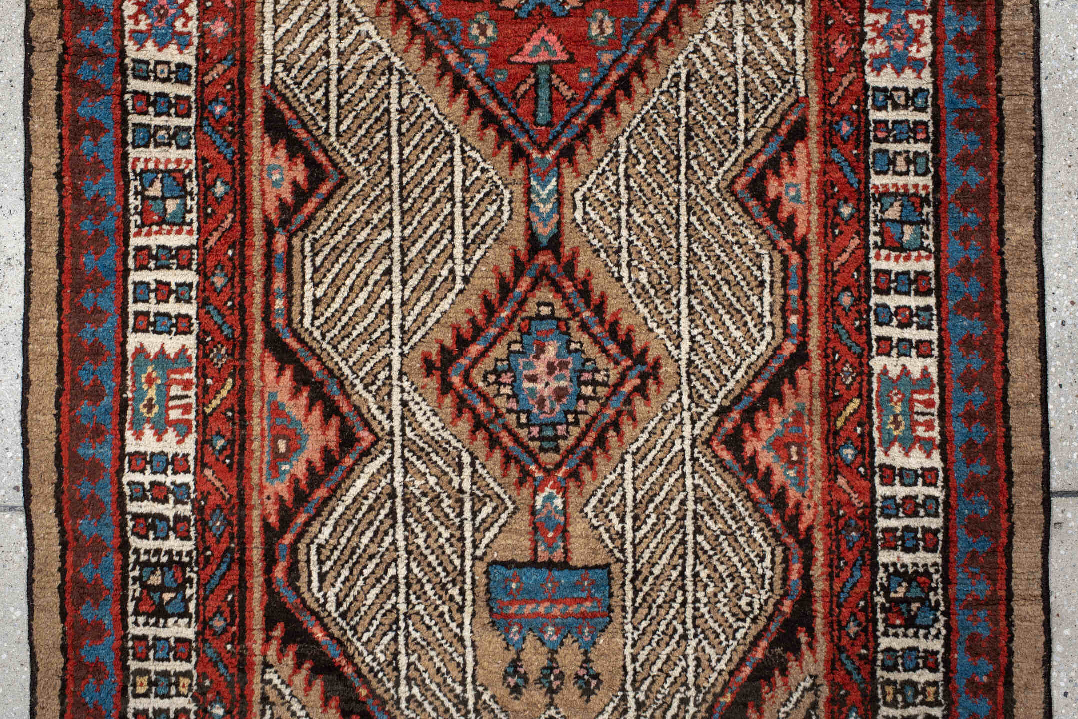 2' x 8' one-of-a-kind handmade antique Sarab runner rug. Color palette: ivory, rust, indigo, camel, rose, charcoal, sky_blue