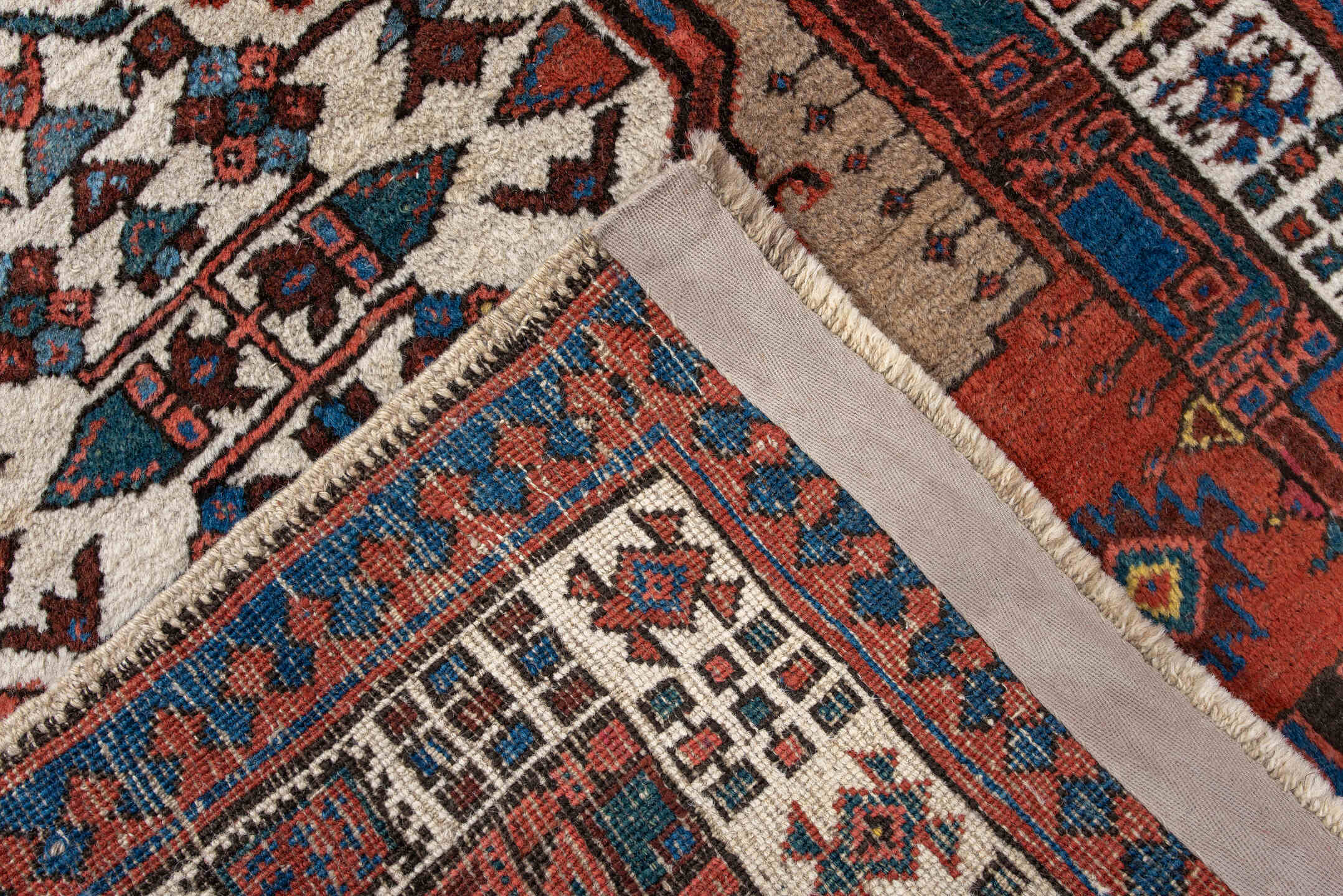 2' x 6' one-of-a-kind handmade antique Sarab runner rug. Color palette: ivory, sky blue, rust, navy, terracotta, brown