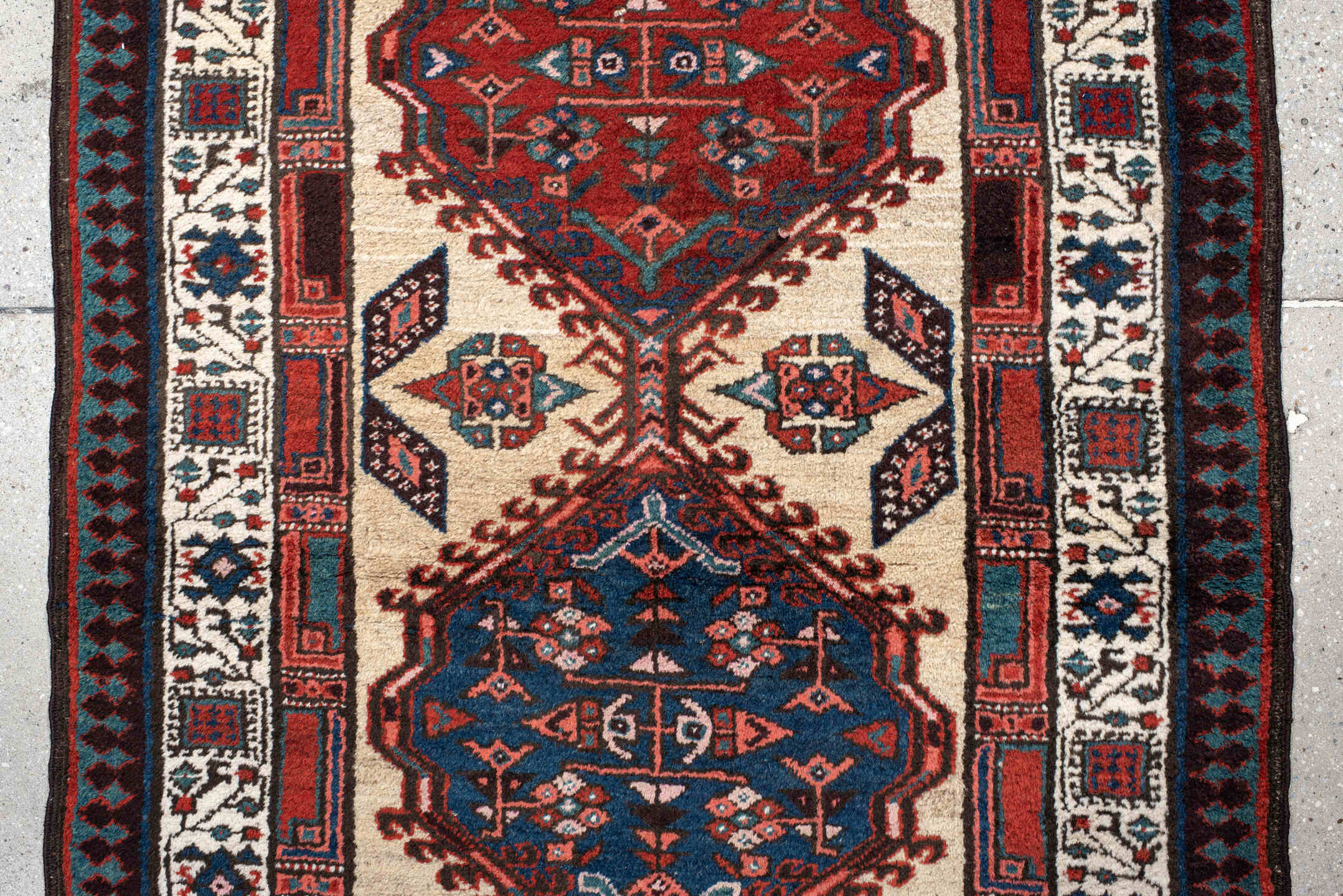 3' x 11' one-of-a-kind handmade antique Sarab runner rug. Color palette: ivory, rust, indigo, navy, crimson, charcoal
