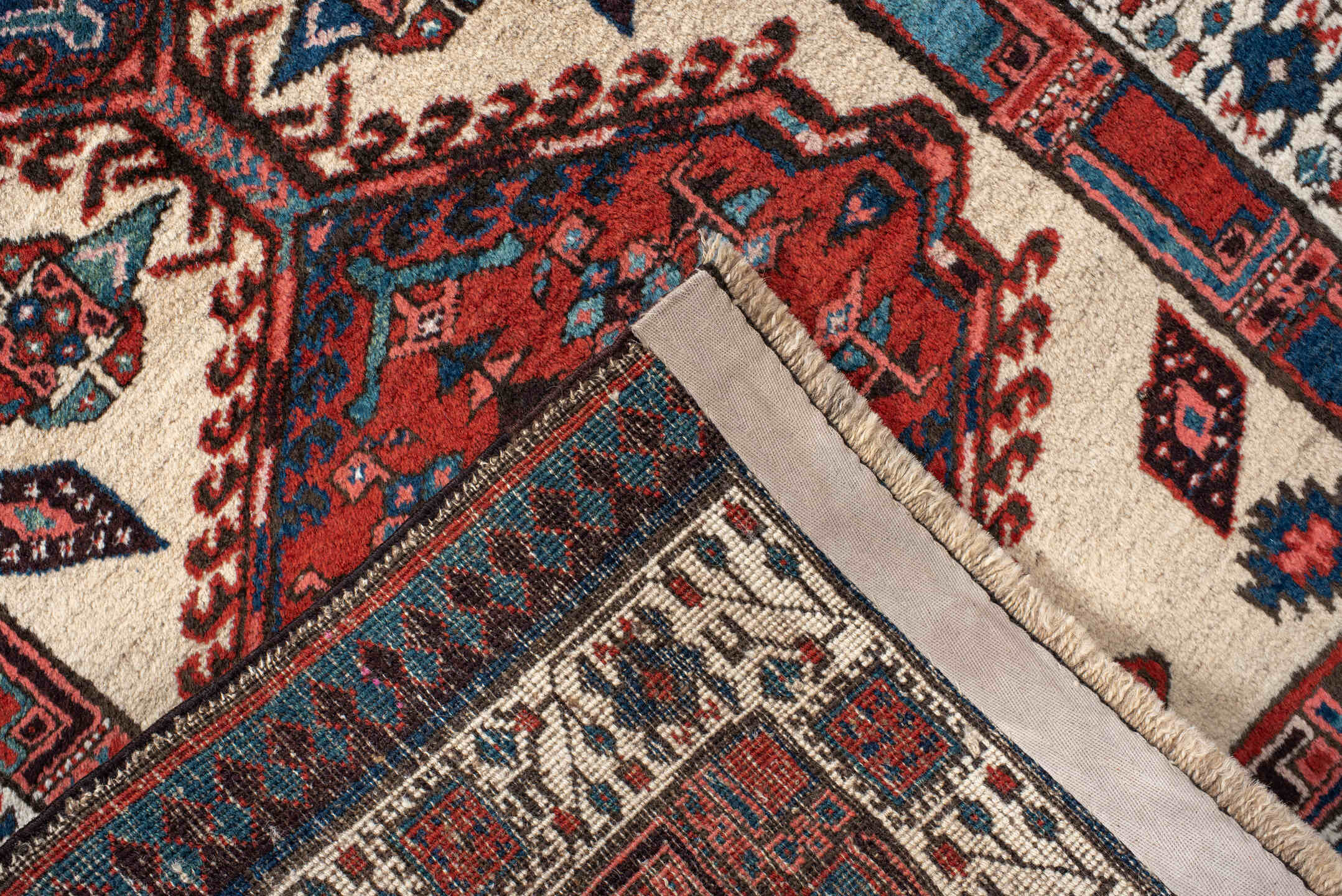 3' x 11' one-of-a-kind handmade antique Sarab runner rug. Color palette: ivory, rust, indigo, navy, crimson, charcoal