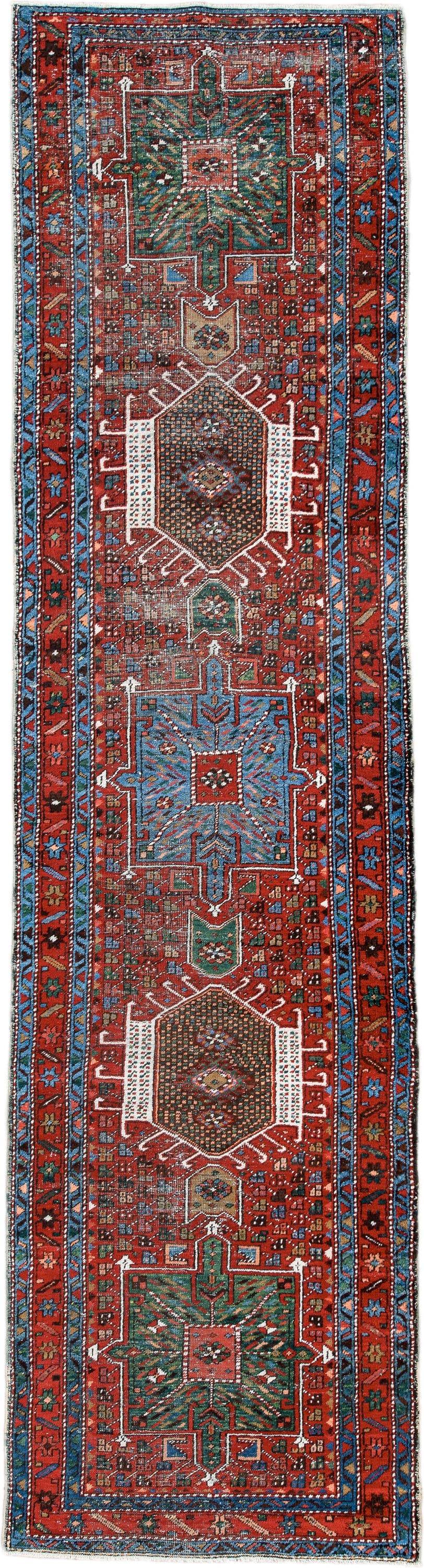 2' x 10' one-of-a-kind handmade antique Karaje runner rug. Color palette: rust, sky blue, ivory, teal, crimson, charcoal