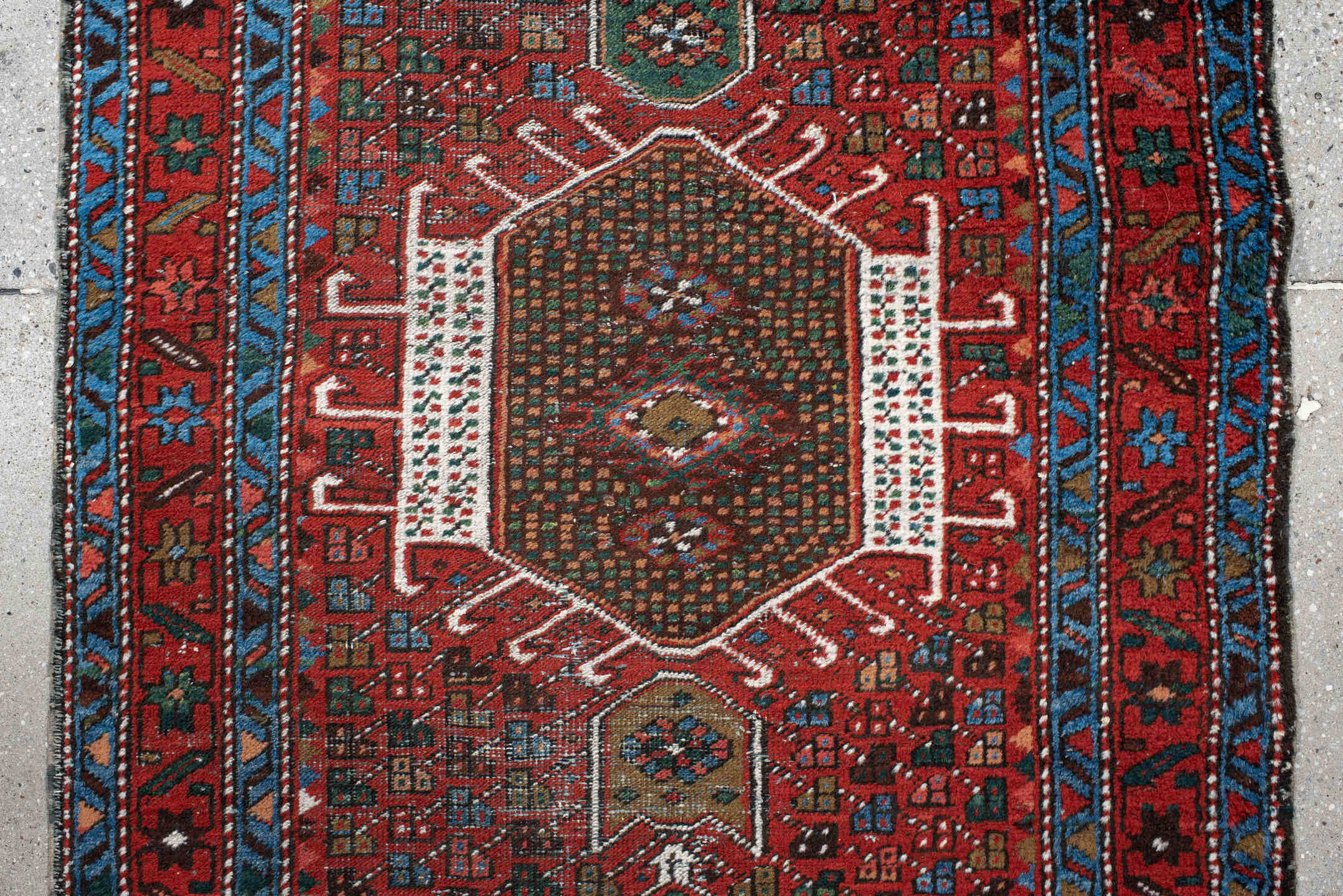2' x 10' one-of-a-kind handmade antique Karaje runner rug. Color palette: rust, sky blue, ivory, teal, crimson, charcoal