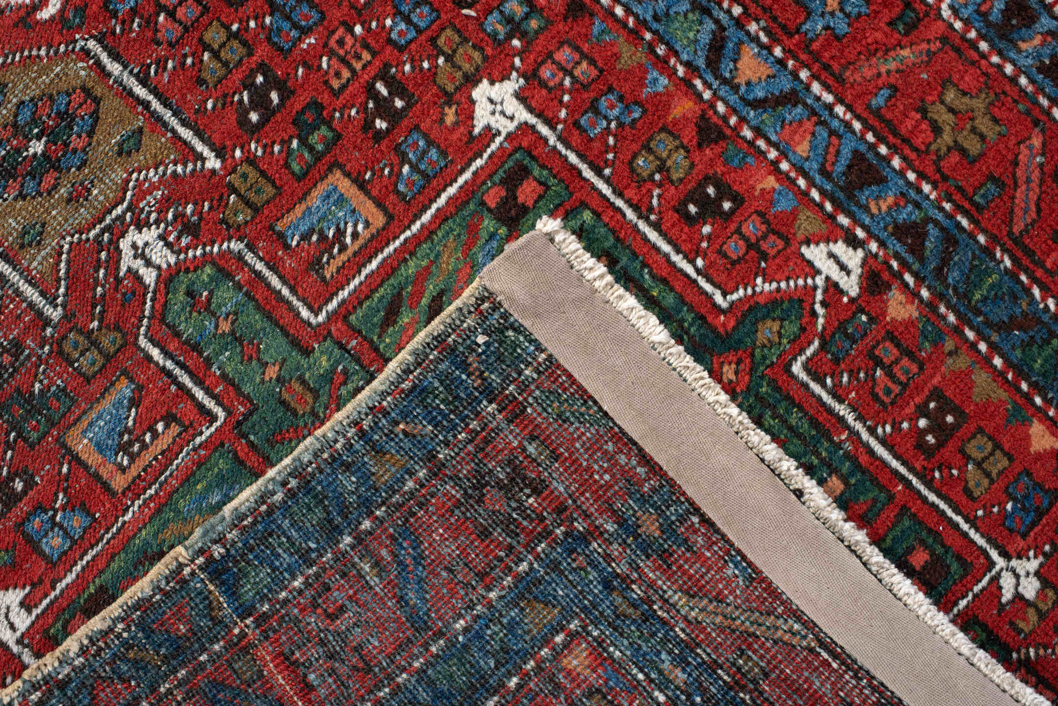 2' x 10' one-of-a-kind handmade vintage Karaje runner rug. Color palette: pink, off-white, red, gray, blue, brown