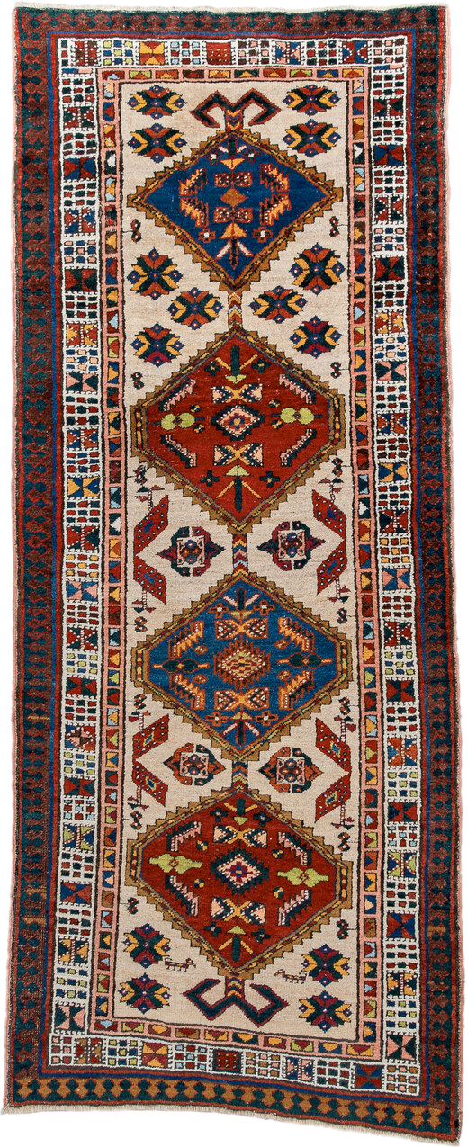 3' x 7' one-of-a-kind handmade antique Sarab runner rug. Color palette: ivory, indigo, rust, camel, navy, coral, gold, sage