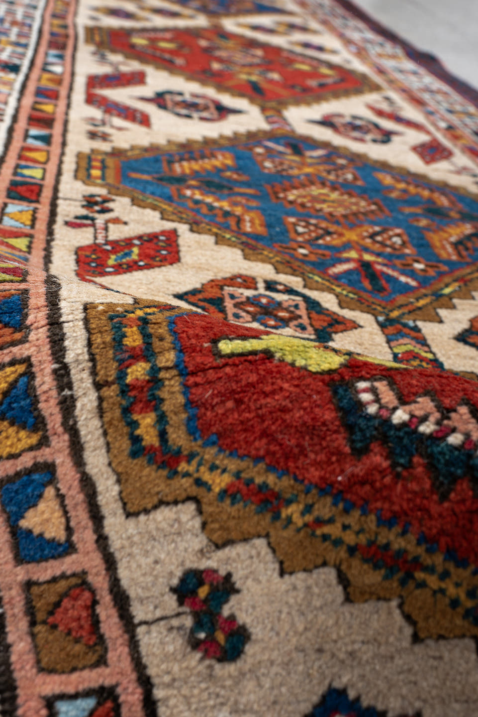 3' x 7' one-of-a-kind handmade antique Sarab runner rug. Color palette: ivory, indigo, rust, camel, navy, coral, gold, sage