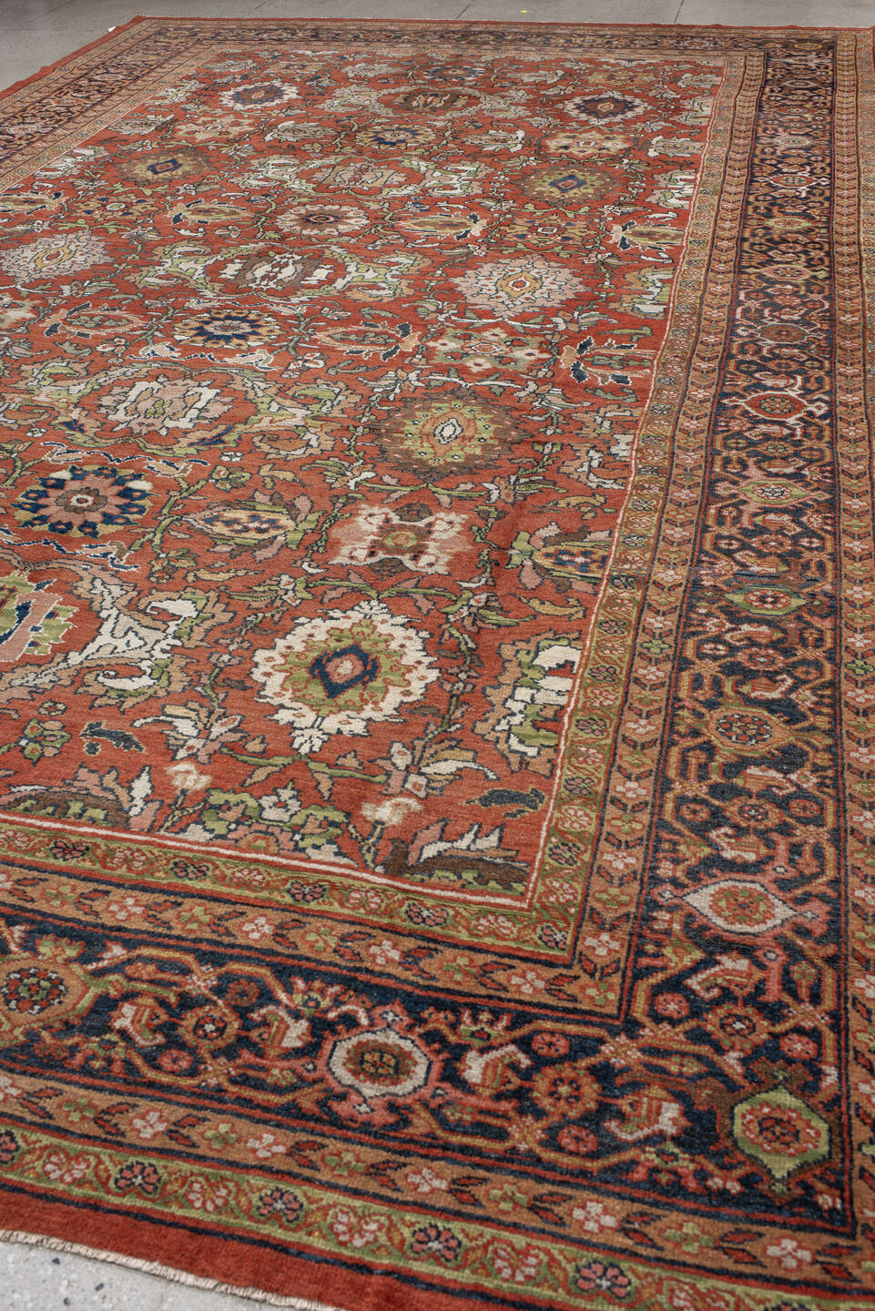 10' x 17' one-of-a-kind handmade antique Mahal rug. Color palette: terra cotta, navy, ivory, sage, gold, rust, olive, camel