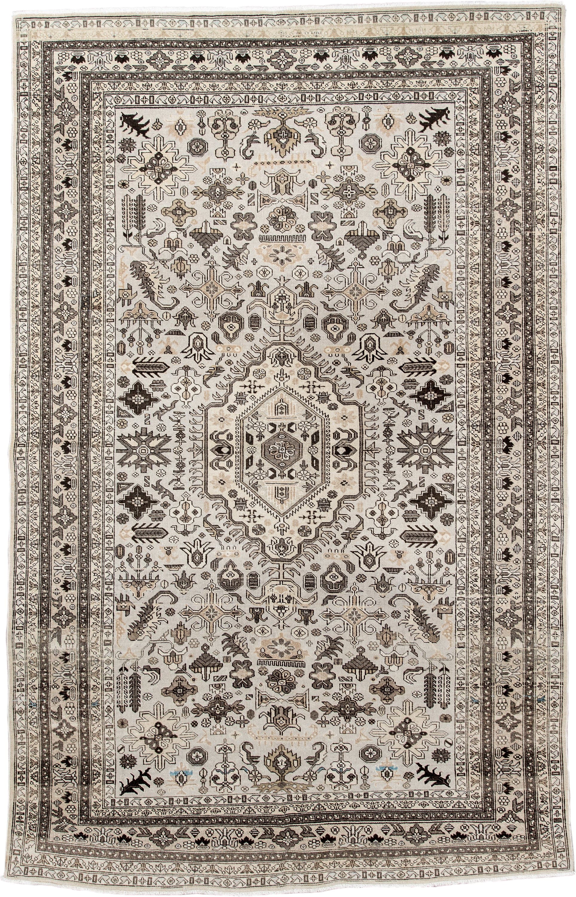5' x 8' one-of-a-kind handmade antique  medium size rug. Color palette: ivory, taupe, brown, charcoal, beige, gray, black