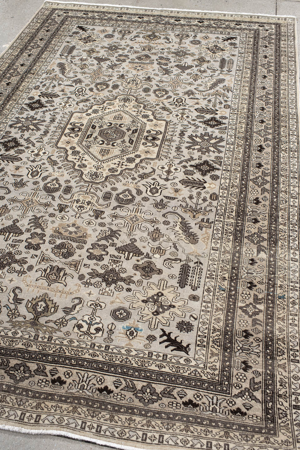 5' x 8' one-of-a-kind handmade antique  medium size rug. Color palette: ivory, taupe, brown, charcoal, beige, gray, black