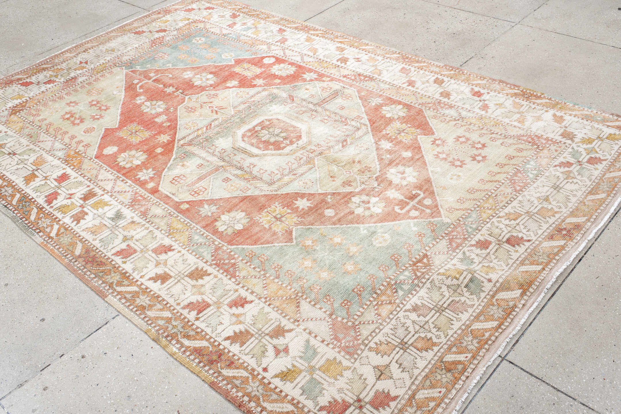6' x 9' one-of-a-kind handmade antique Anatolian medium size rug. Color palette: ivory, coral, sage, pale_blue, taupe, gold