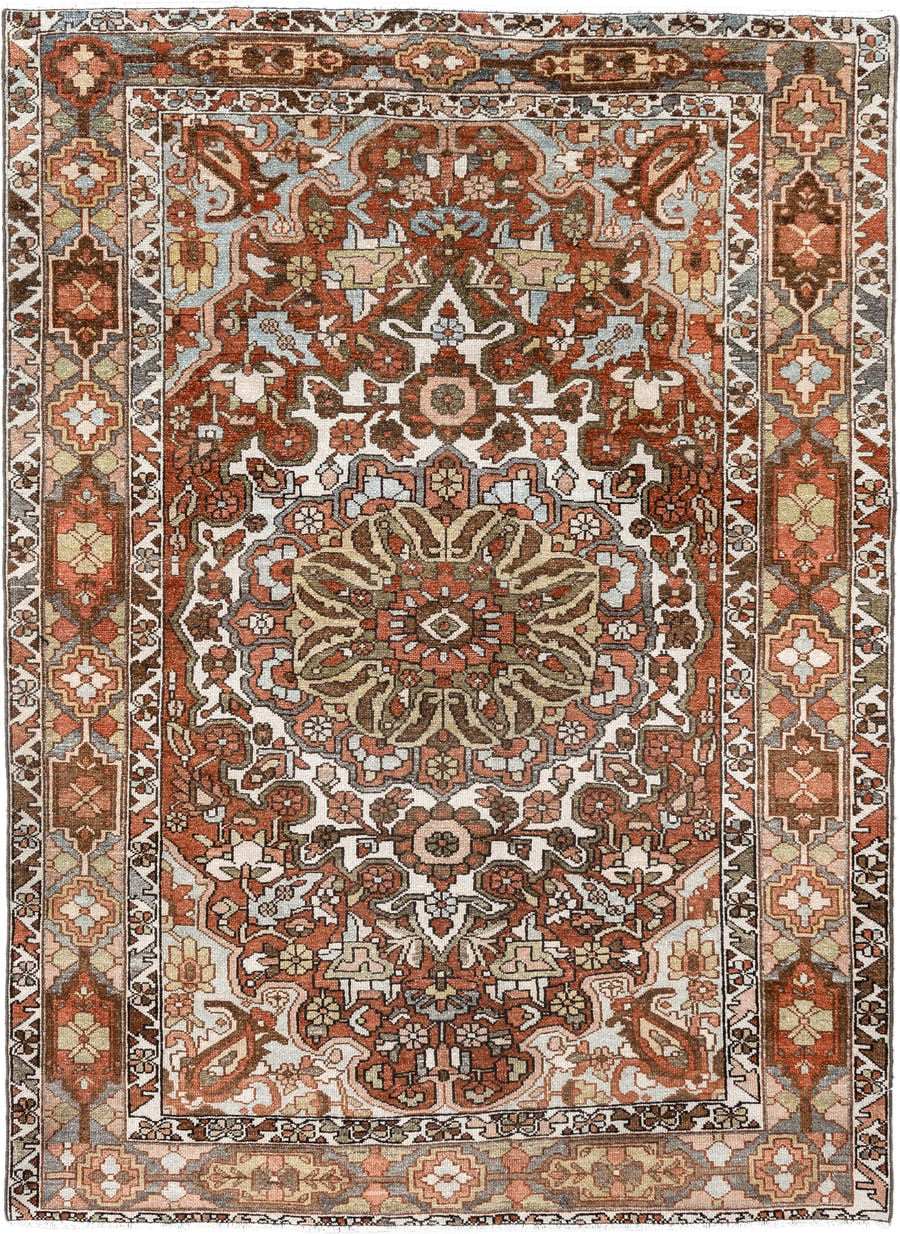 4' x 6' one-of-a-kind handmade vintage Baktiary small size rug. Color palette: ivory, rust, brown, sky blue, taupe, camel