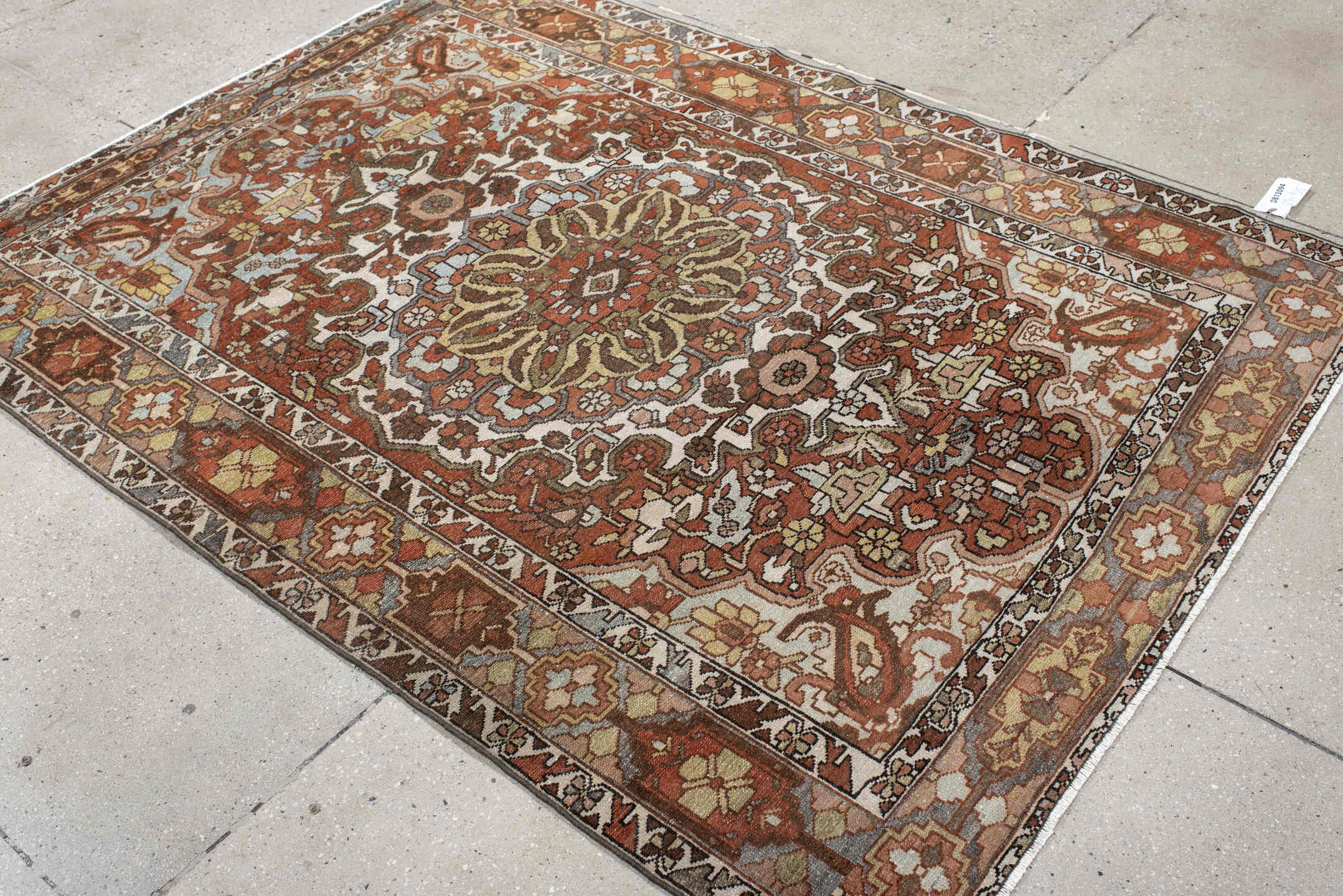 4' x 6' one-of-a-kind handmade vintage Baktiary small size rug. Color palette: ivory, rust, brown, sky blue, taupe, camel