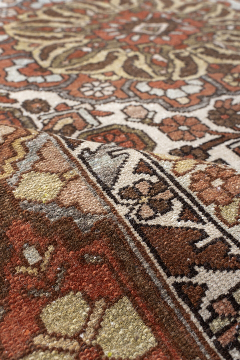 4' x 6' one-of-a-kind handmade vintage Baktiary small size rug. Color palette: ivory, rust, brown, sky blue, taupe, camel