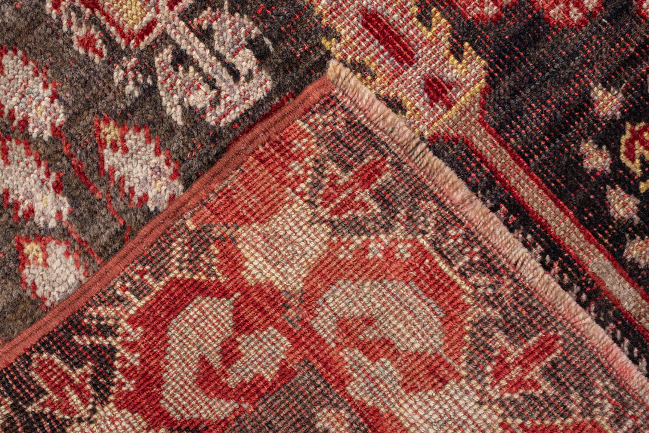 4' x 7' one-of-a-kind handmade vintage Anatolian rug. Color palette: charcoal, rust, ivory, rose, taupe, mahogany, black