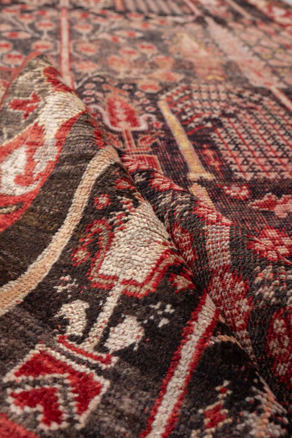 4' x 7' one-of-a-kind handmade vintage Anatolian rug. Color palette: charcoal, rust, ivory, rose, taupe, mahogany, black