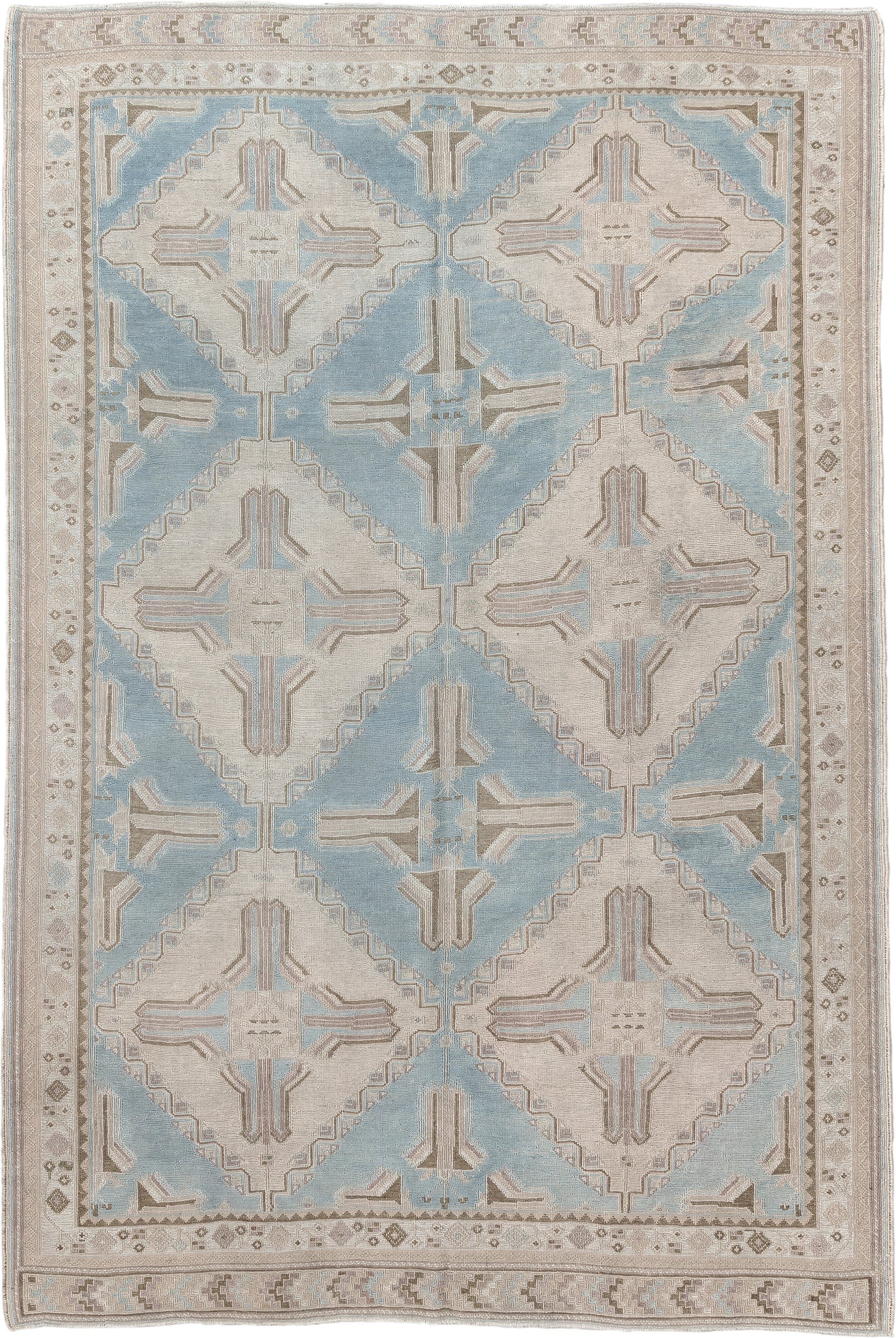 5' x 7' one-of-a-kind handmade antique Sumak rug. Color palette: ivory, light blue, taupe, beige, camel, gray