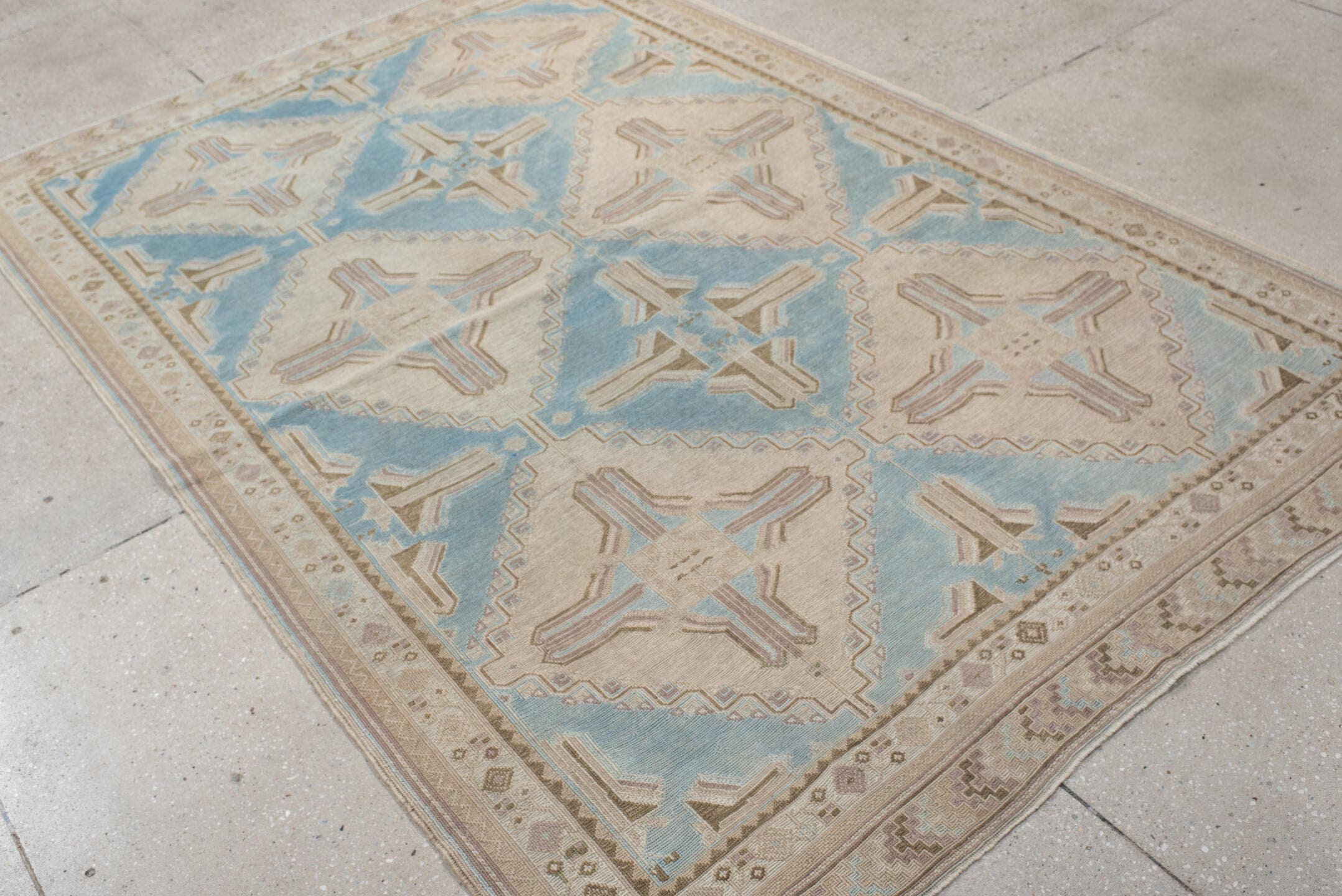 5' x 7' one-of-a-kind handmade antique Sumak rug. Color palette: ivory, light blue, taupe, beige, camel, gray