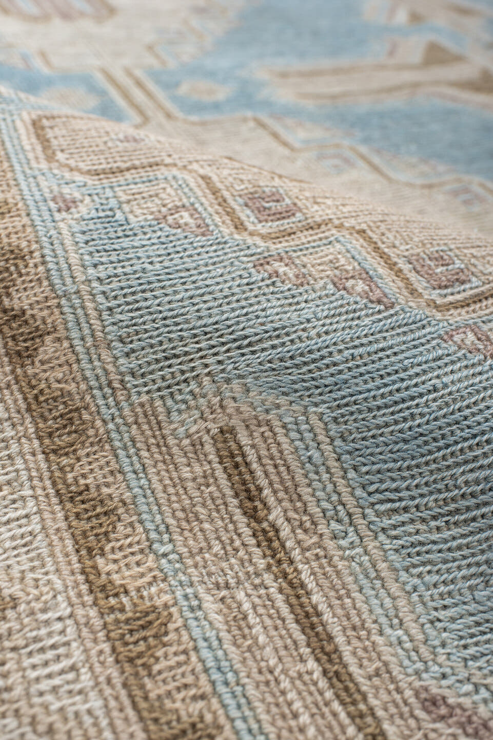 5' x 7' one-of-a-kind handmade antique Sumak rug. Color palette: ivory, light blue, taupe, beige, camel, gray
