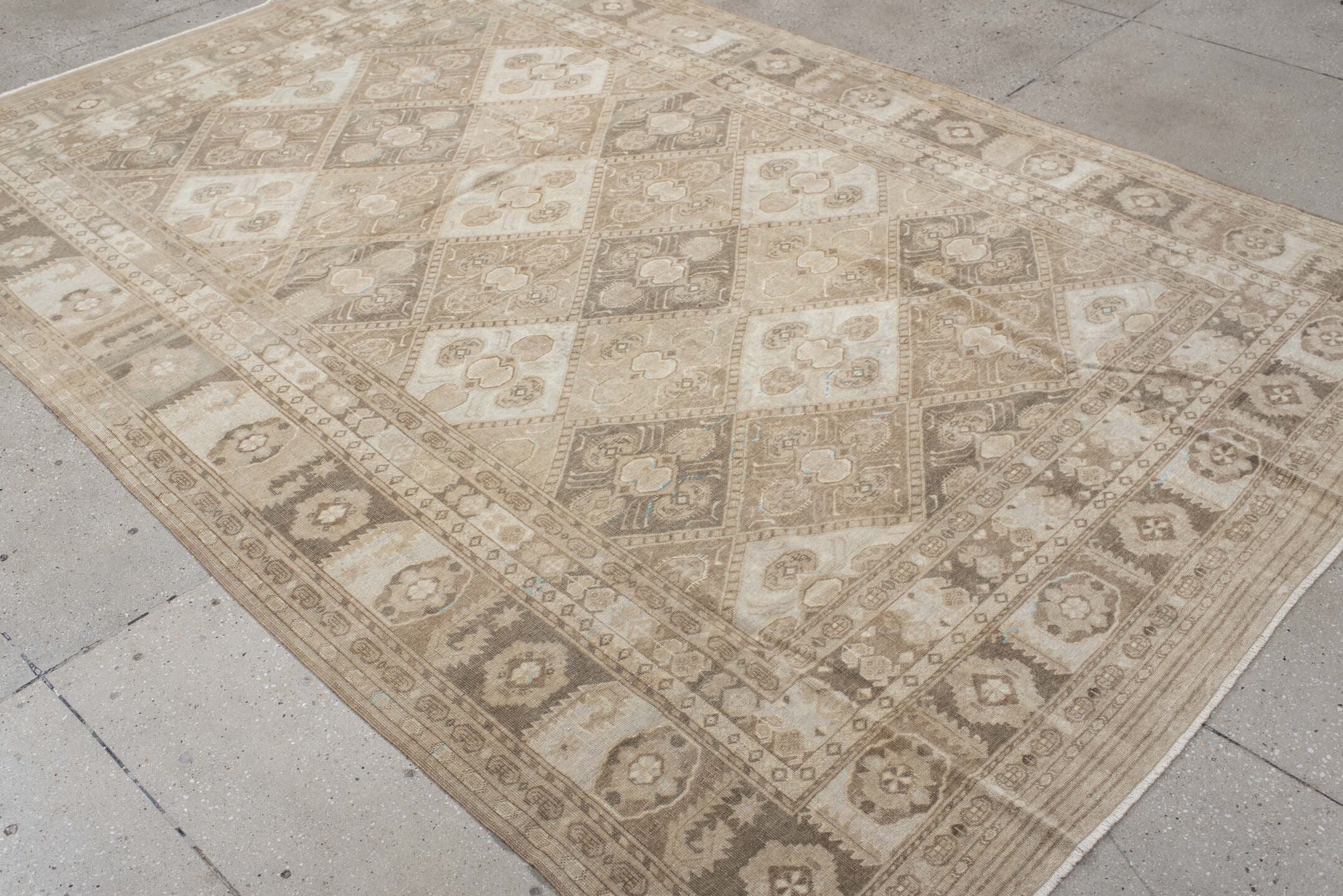 6' x 9' one-of-a-kind handmade antique Afghan medium size rug. Color palette: ivory, taupe, camel, beige, brown, sand