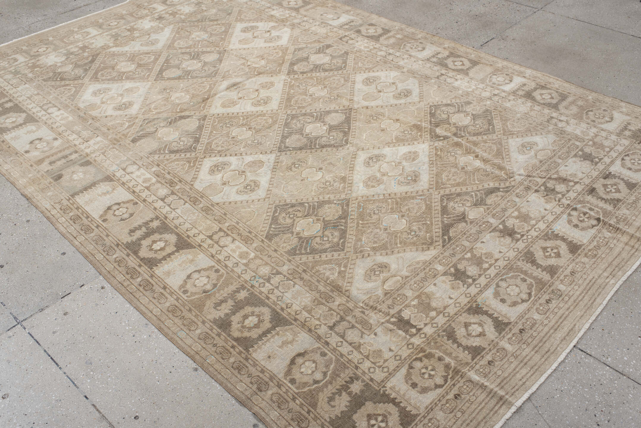 6' x 9' one-of-a-kind handmade antique Afghan medium size rug. Color palette: ivory, taupe, camel, beige, brown, sand